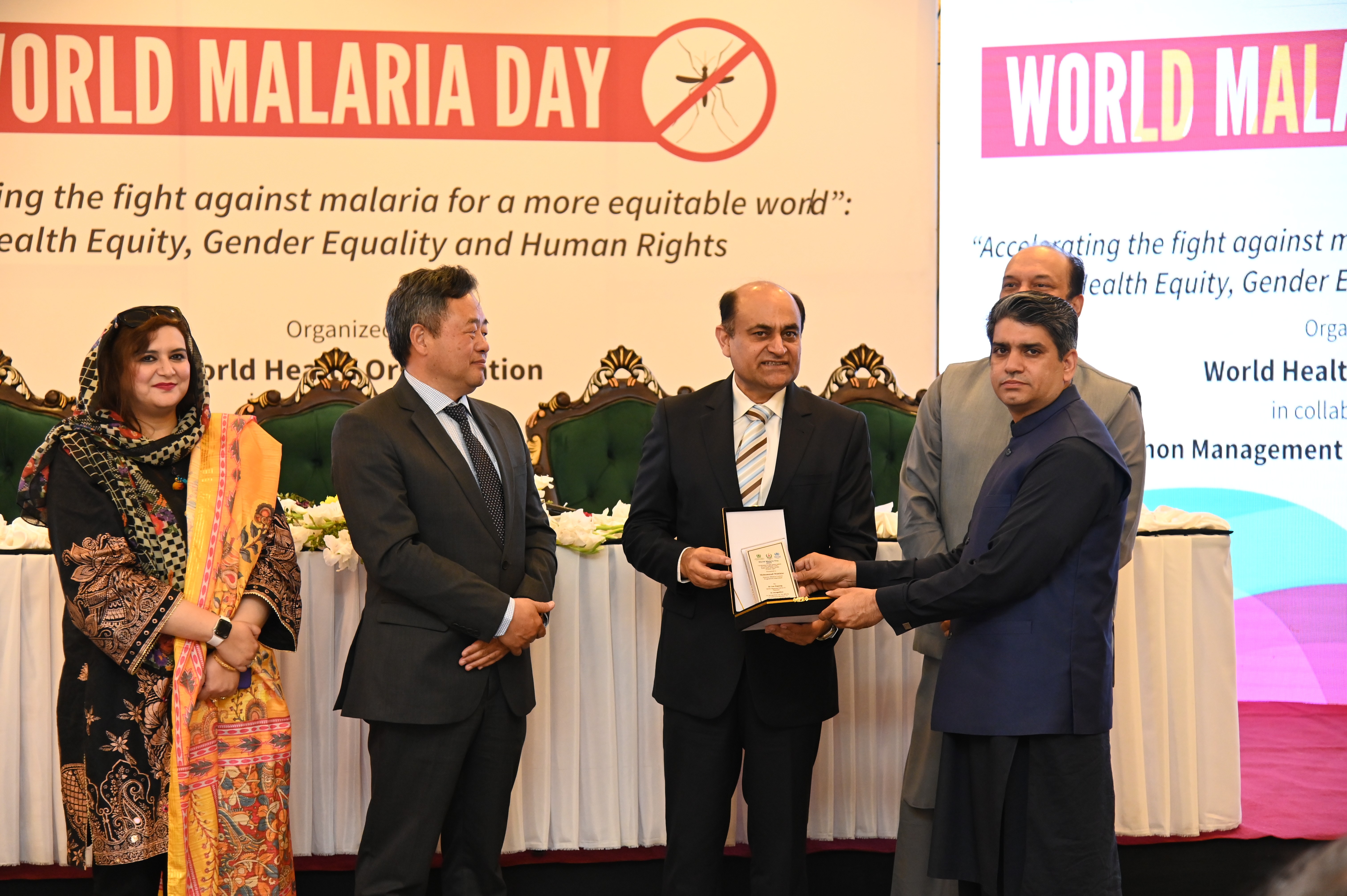 The shield distribution at the event of World Malaria Day 2035