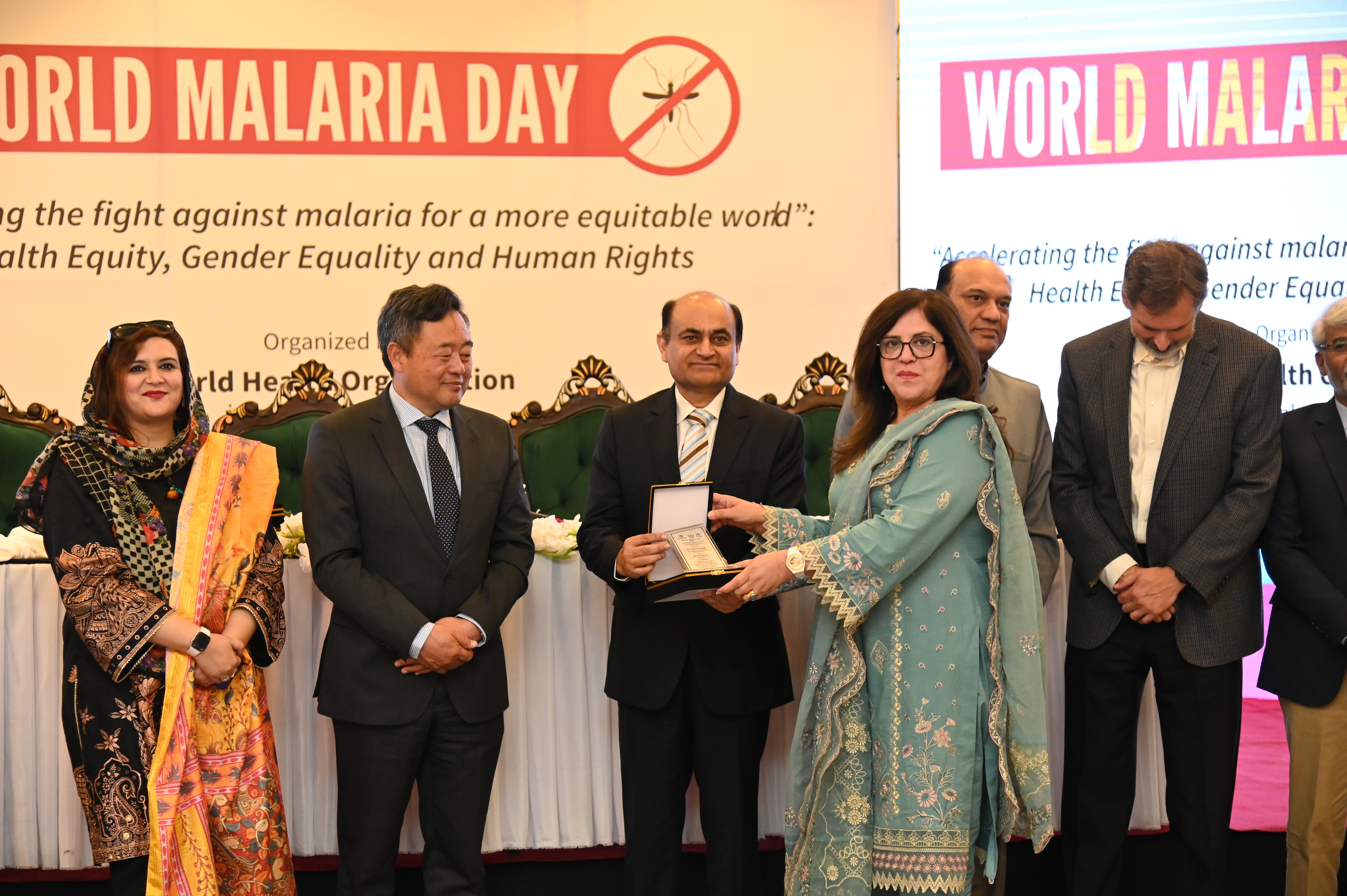 The shield distribution at the event of World Malaria Day 2038