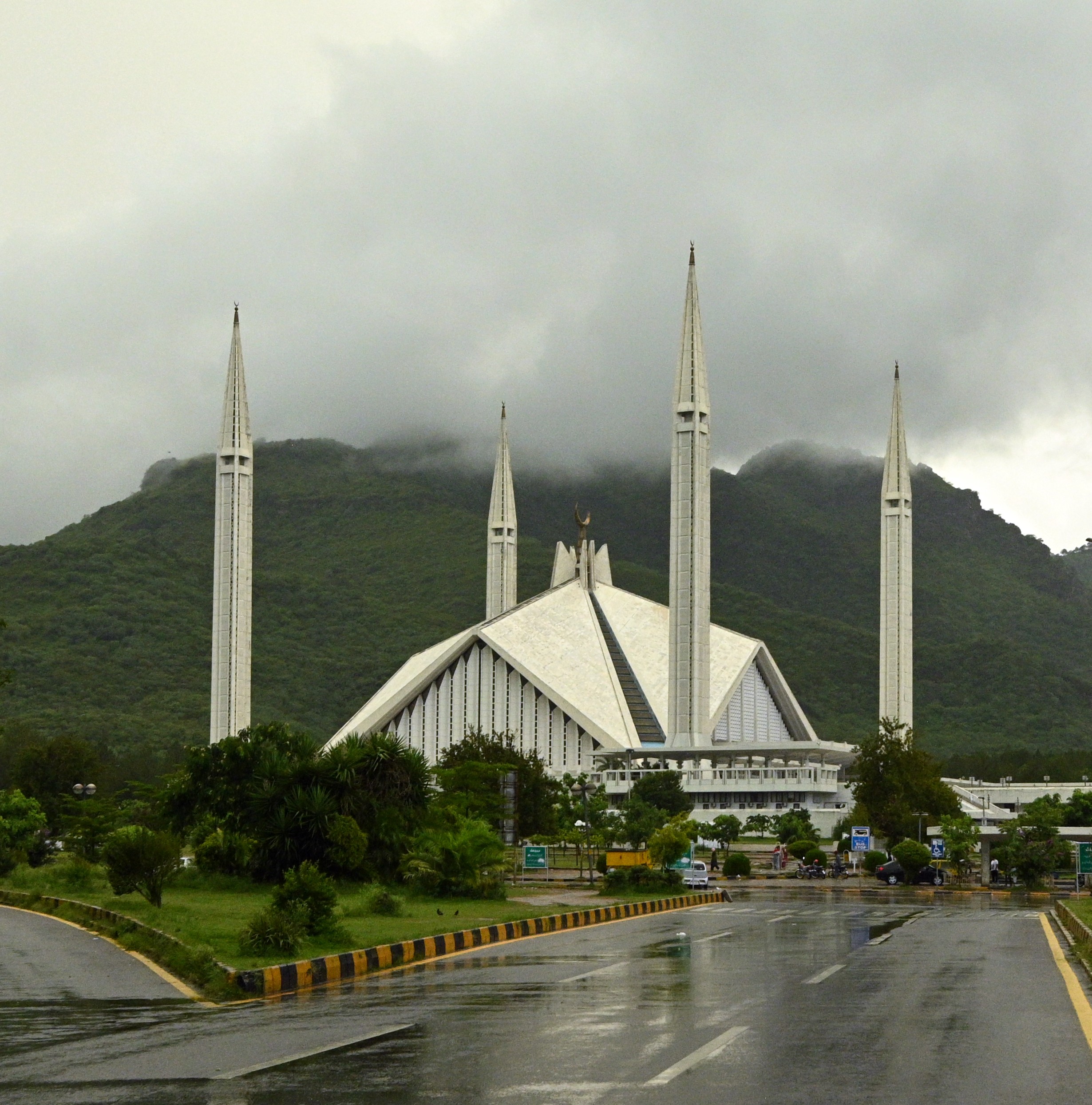 A beautiful view of shah faisal mosque with cloud capped margalla hills