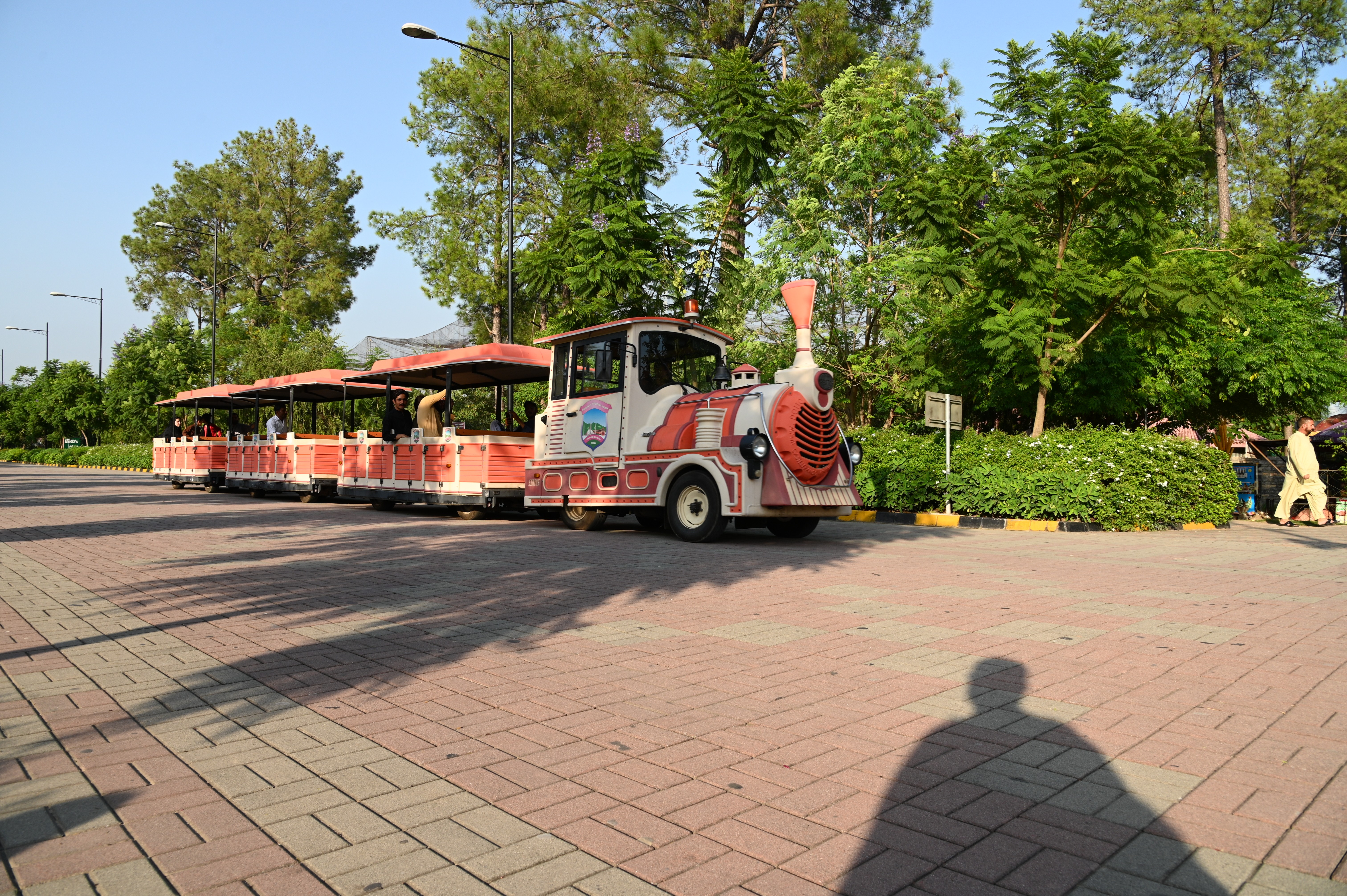 people having a ride on mini tourist train launched by CDA in lake view