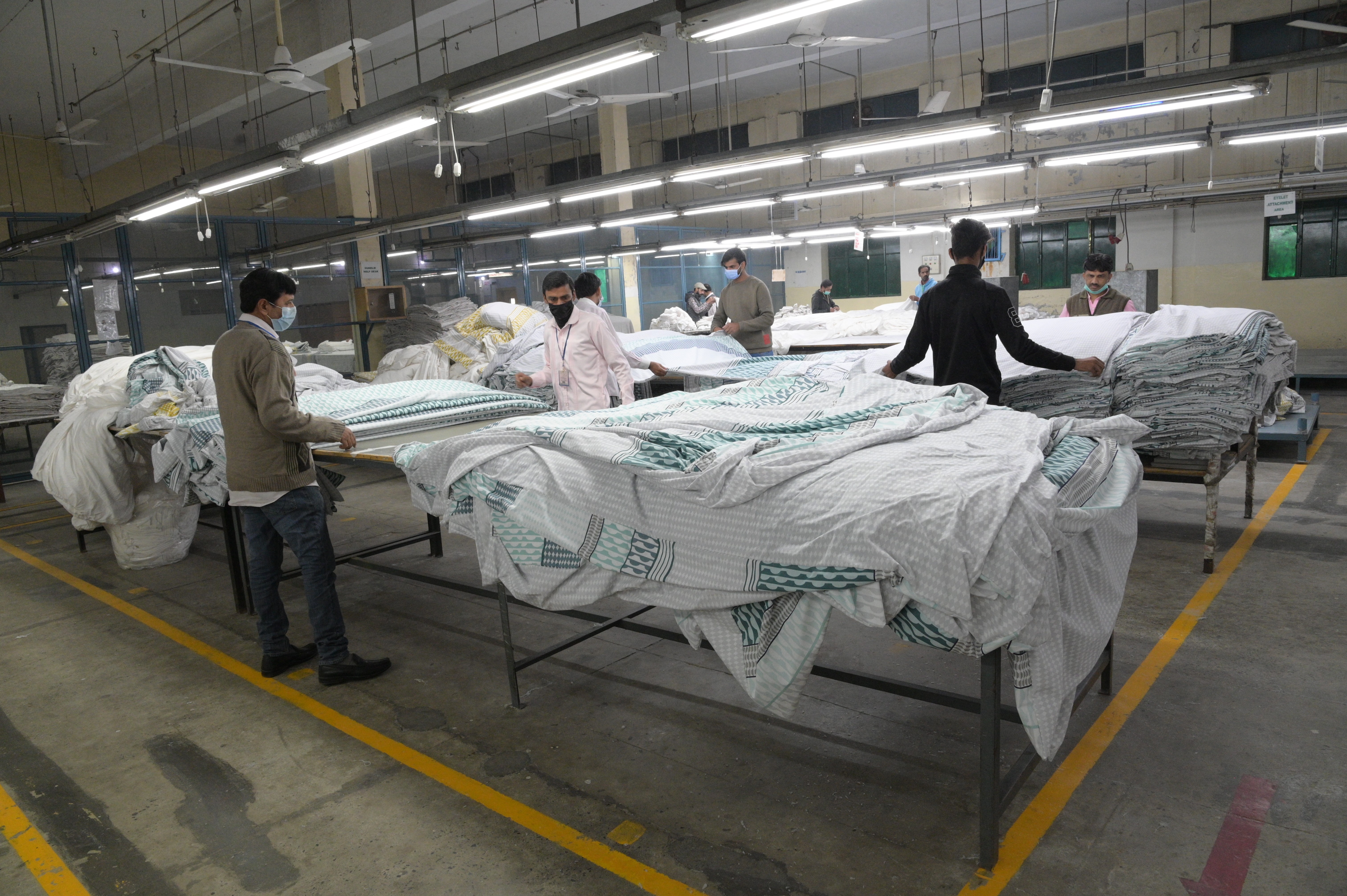 workers folding the fabric
