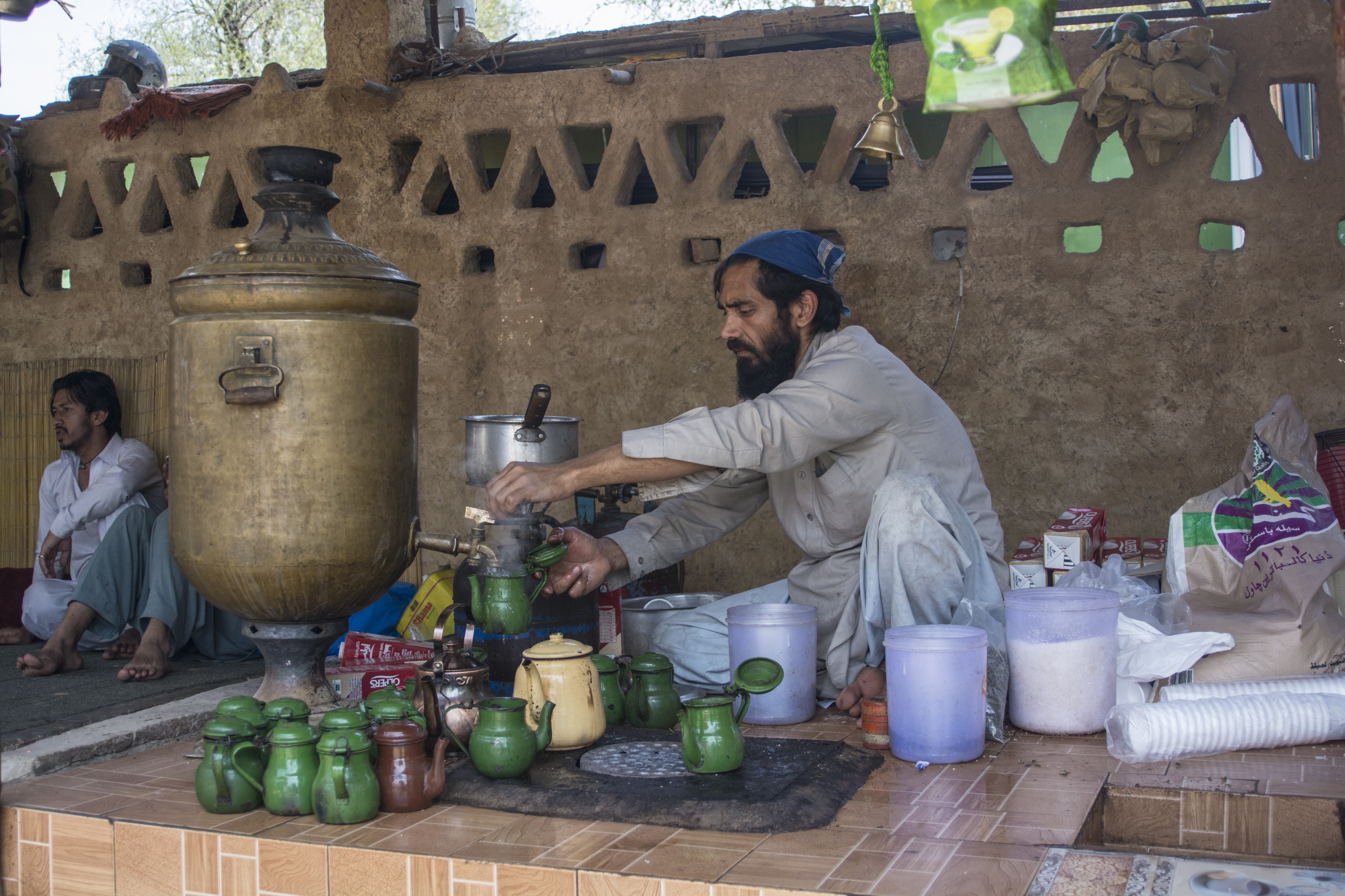 a man selling variety of tea at his stall