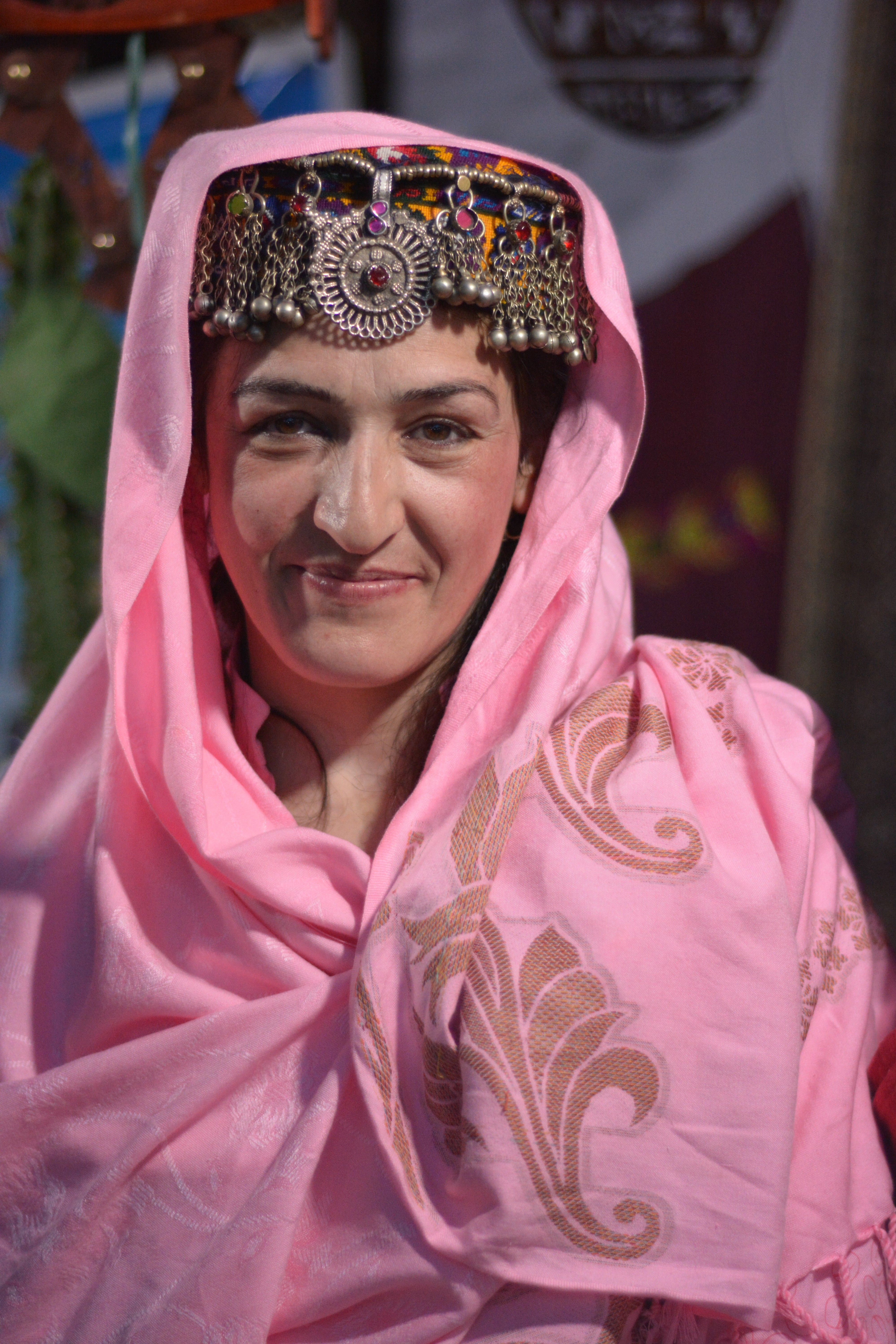 A woman wearing traditional cap of Hunza