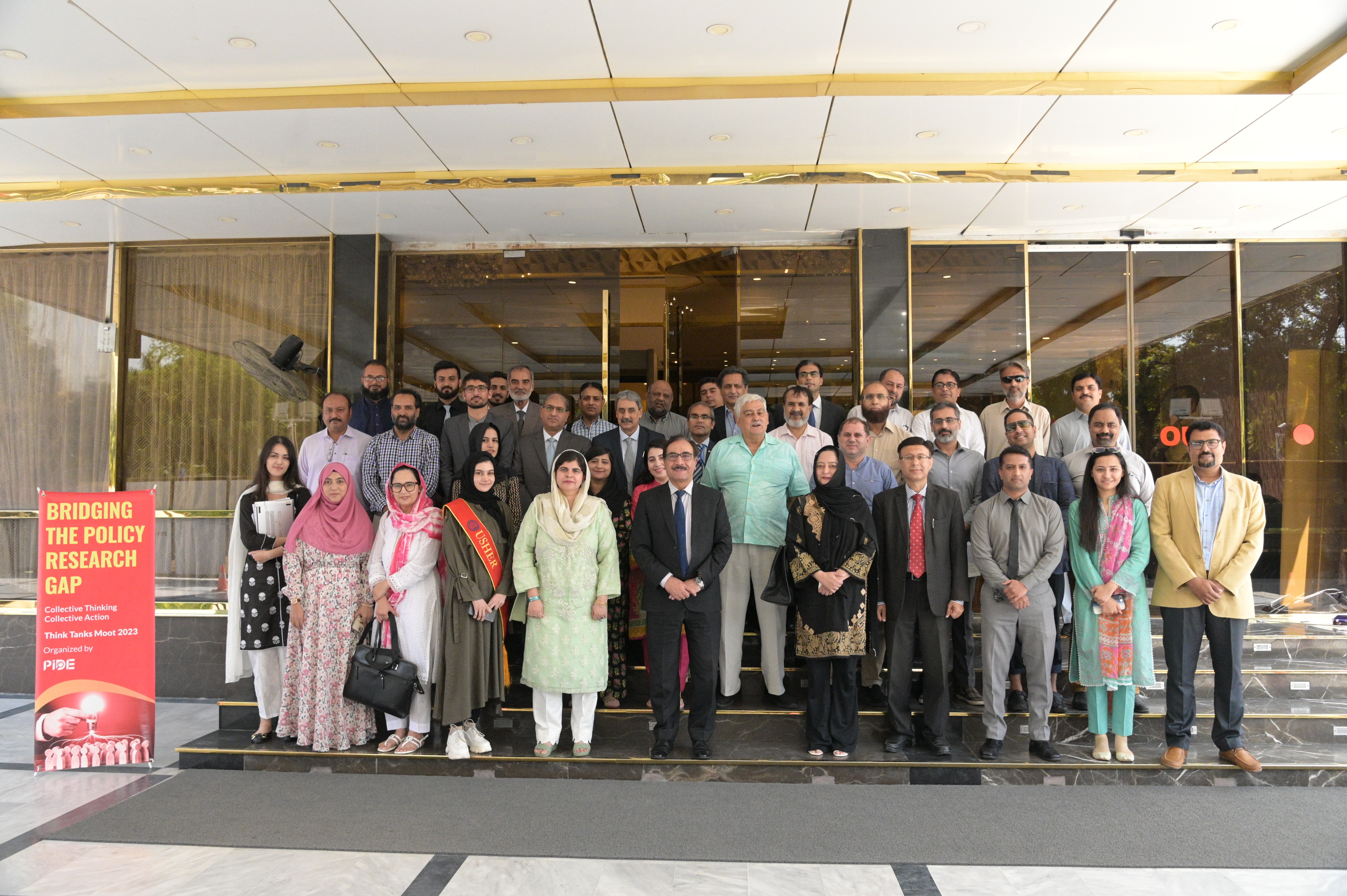 A group photo of all the participants of reform synergy with the event organizers and vice chancellor of PIDE Nadeem ul Haque