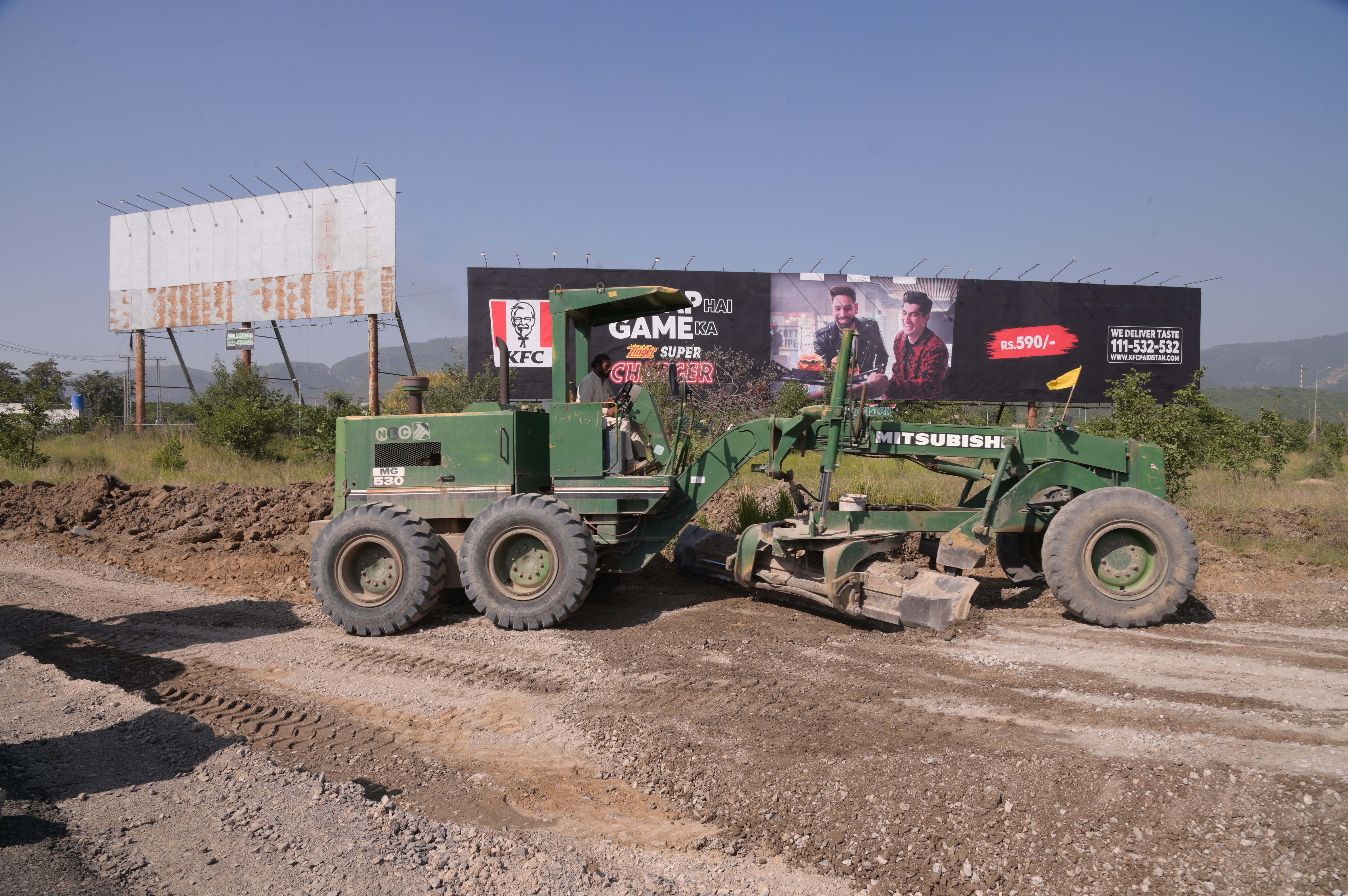 Heavy machinery deployed by the National Logistic Cell (NLC) at the construction site in the remote areas of Federal Capital of Pakistan