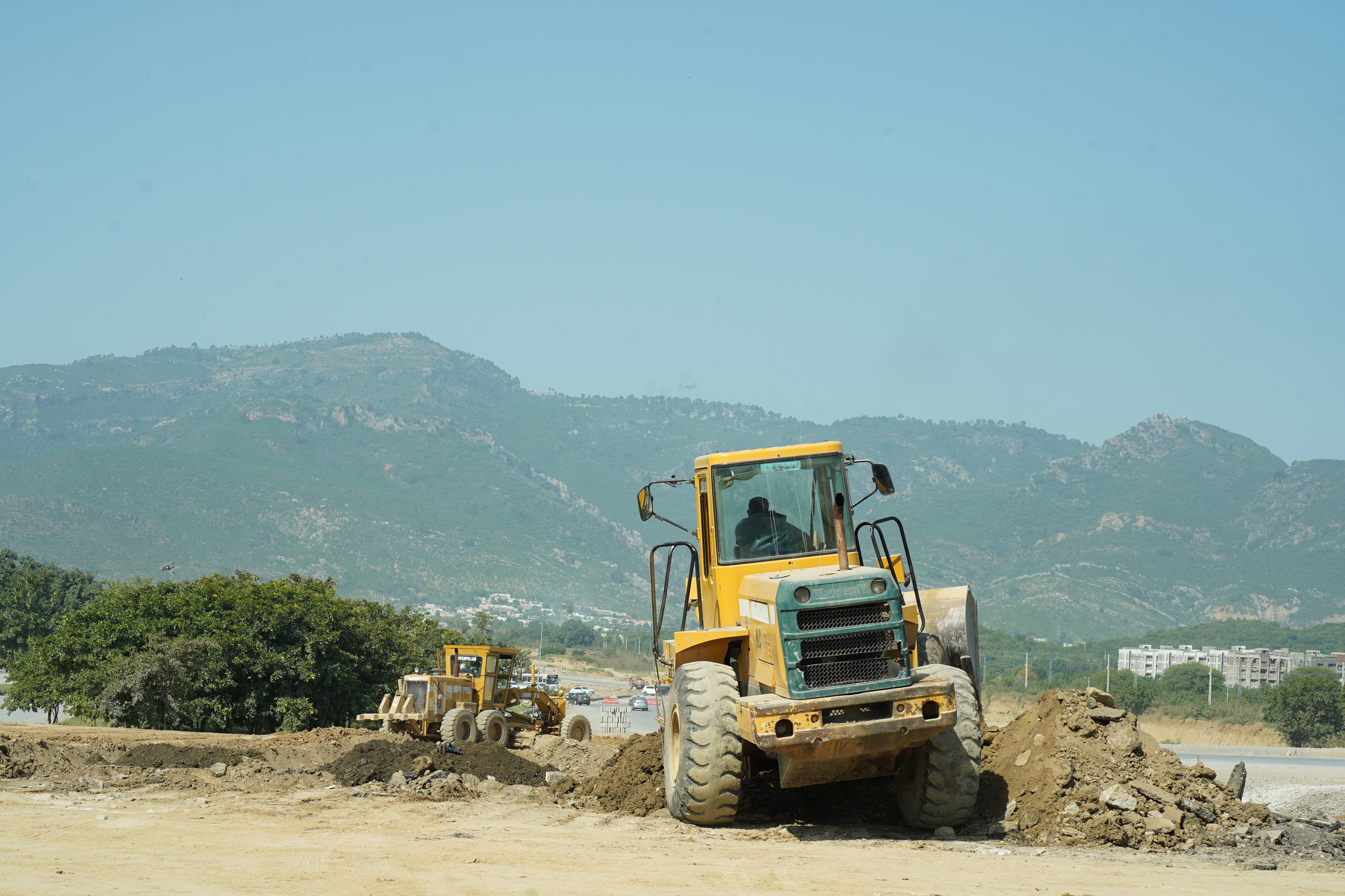 Heavy machinery deployed by the National Logistic Cell (NLC) at the construction site in the remote areas of Federal Capital of Pakistan