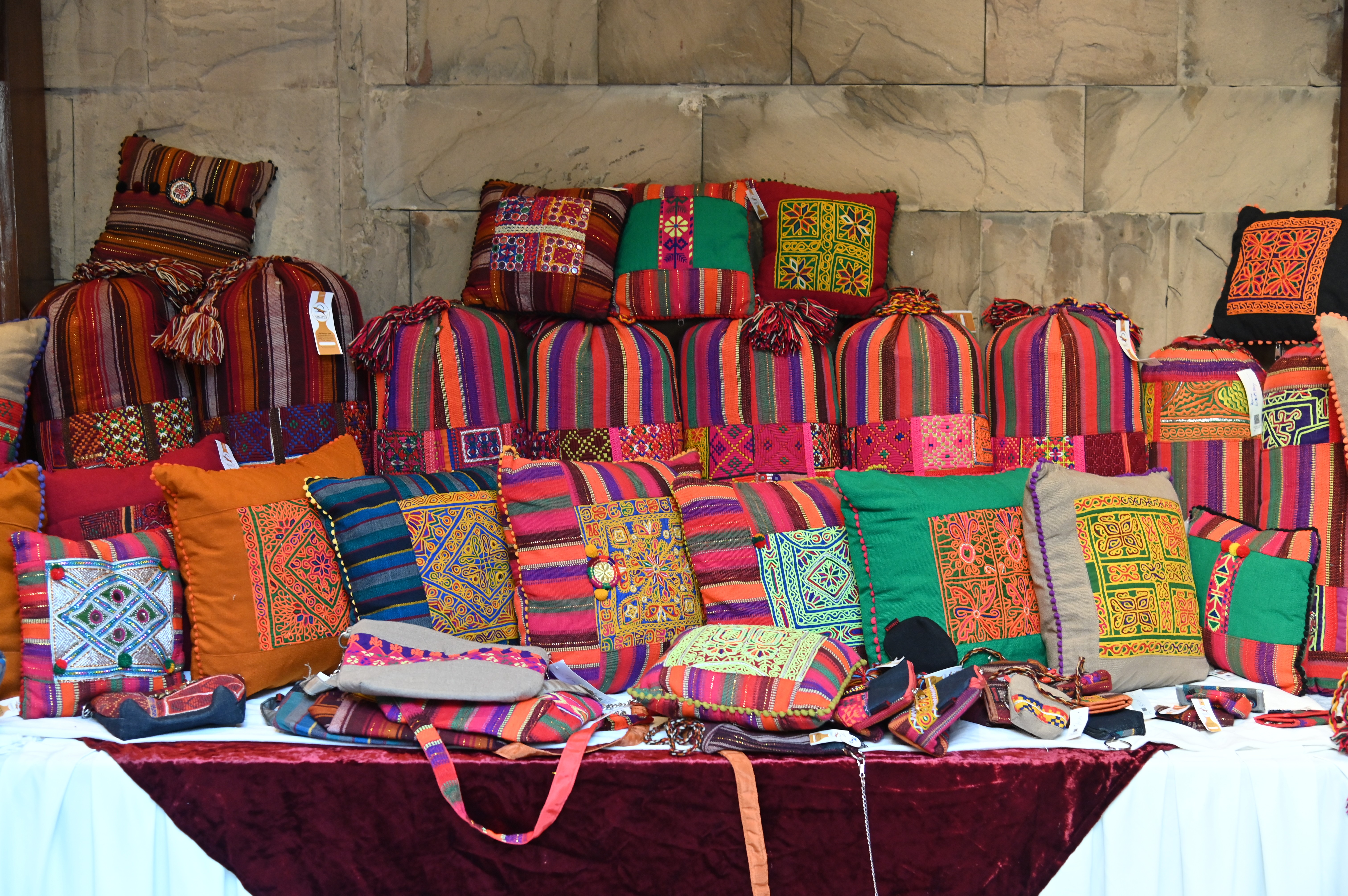 The colorful embroidered handbags and cushions