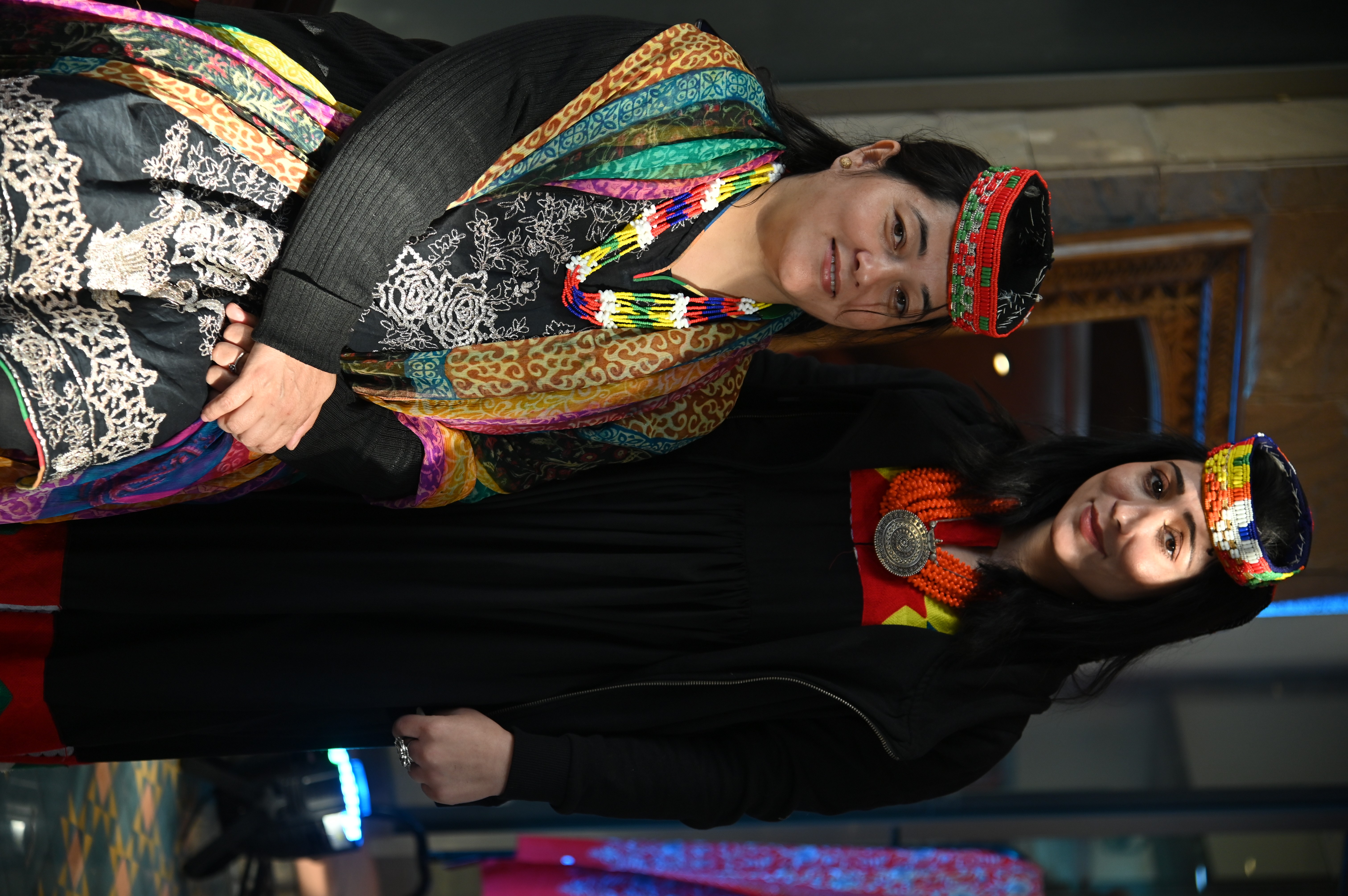 Women symbolizing the northern culture of Pakistan  by wearing an ethenic traditional cap made of colorful beads