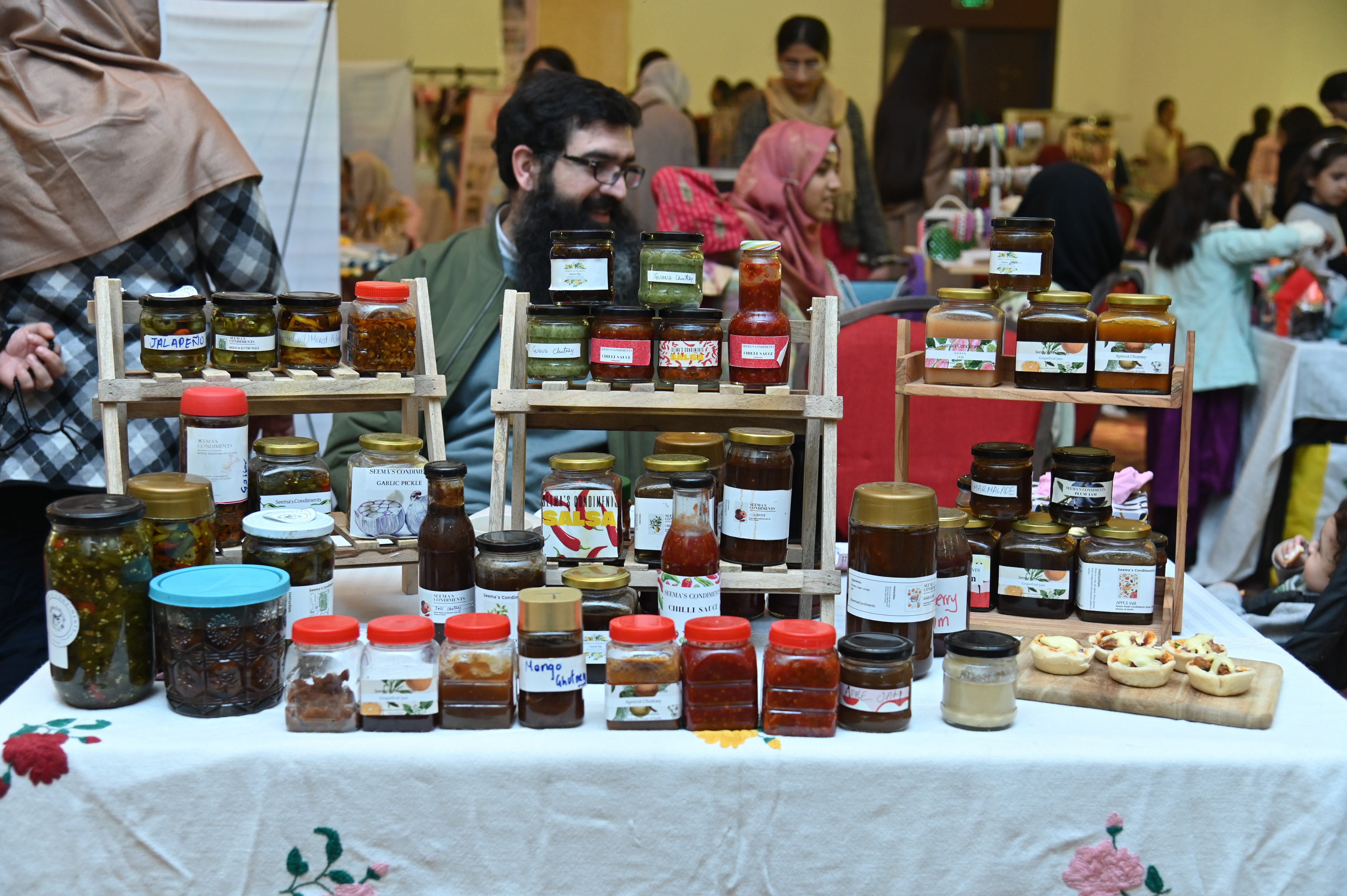A man selling various sauces and Muraba(a sweet fruit preserve which is popular in many regions of Asia)