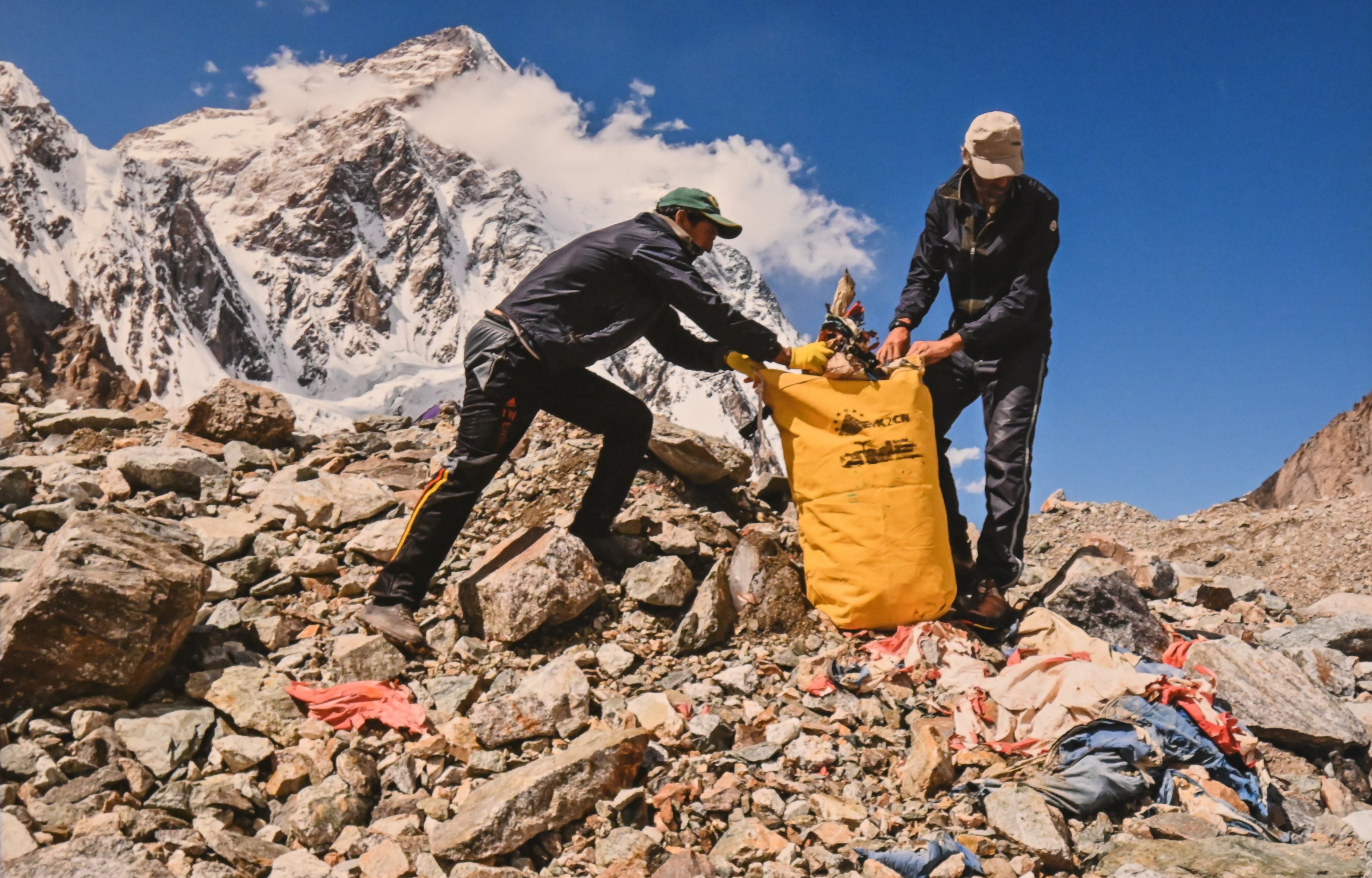A volunteer collecting  plastic waste from the mountain region to keep it clean