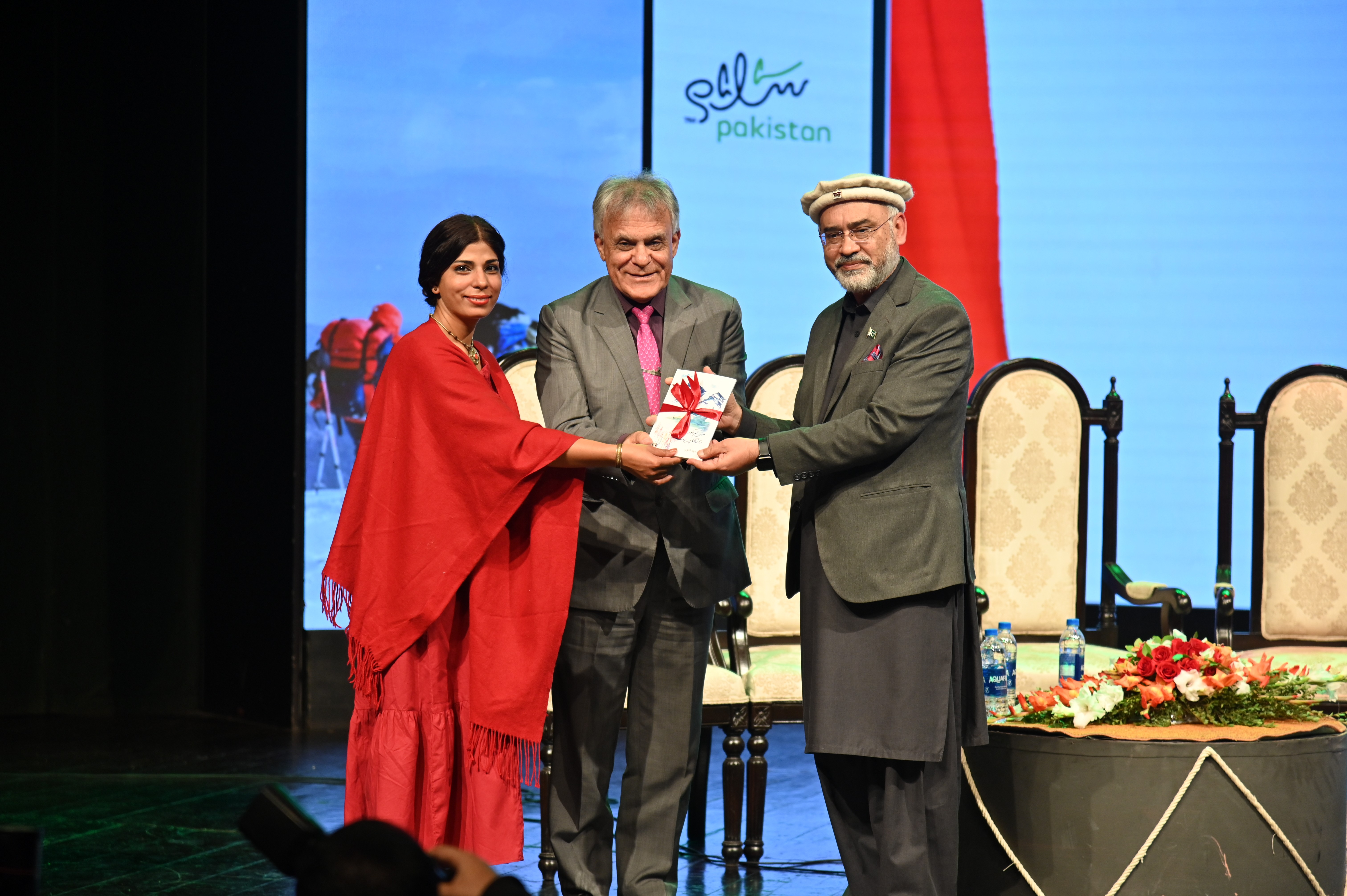 A book being presented to the chief guest