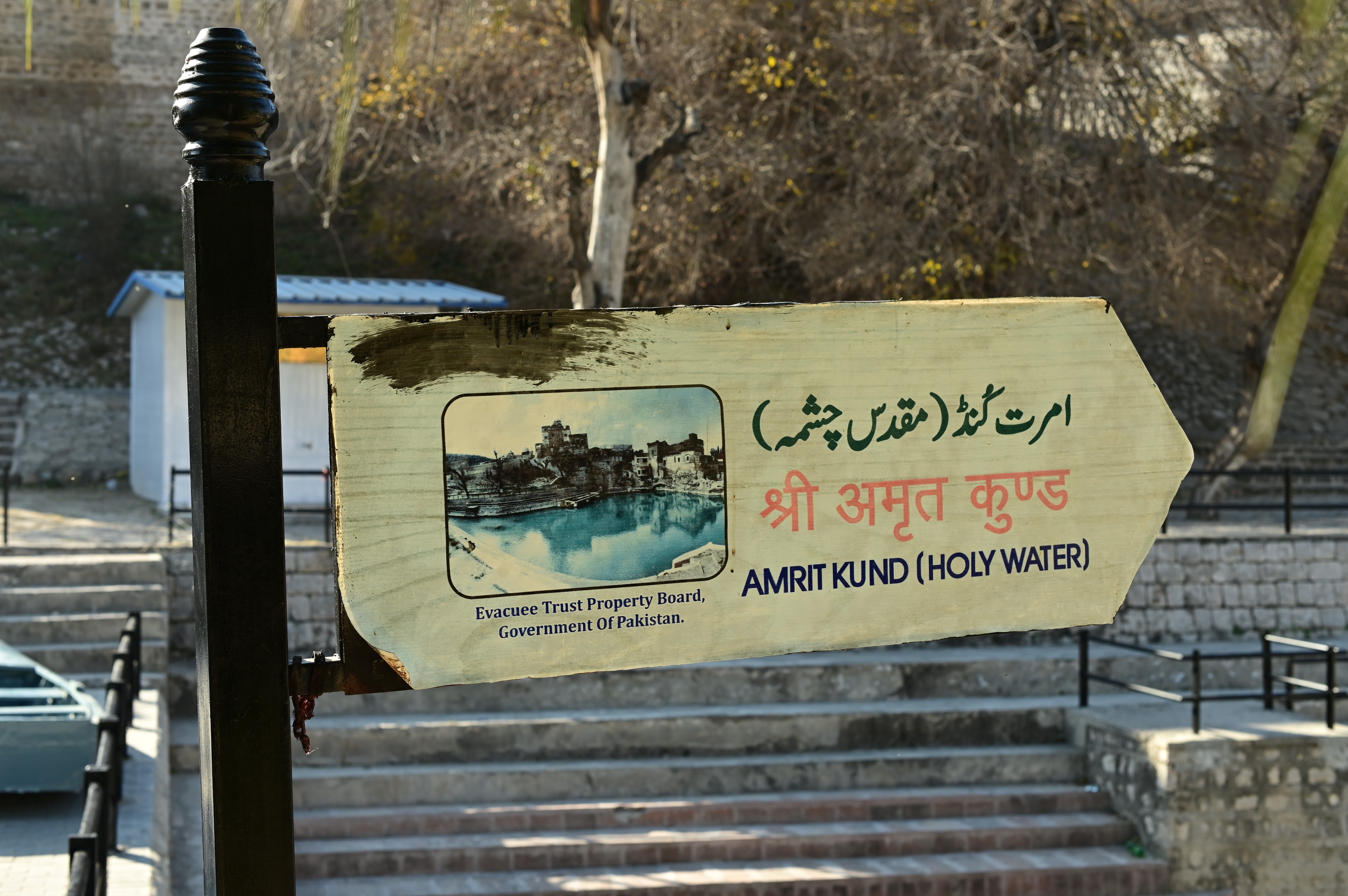 The Direction board indicating the location of Amrit Kund sacred pond that surrounds all the temples at Katas Raj