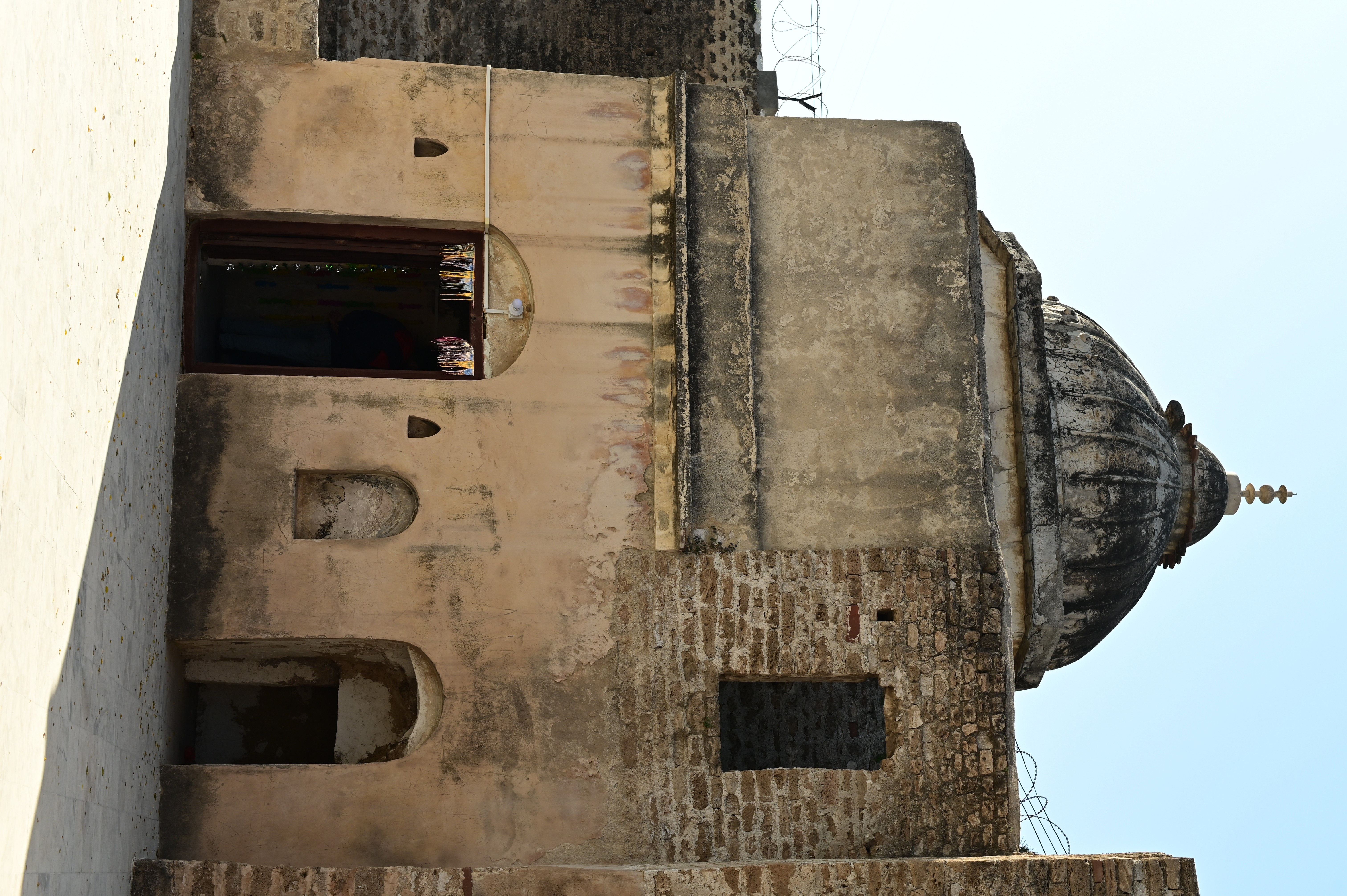 The exterior view of crumbling beauty and fading colors of Katas Raj Temples symbolizing the ancient Hindu Culture