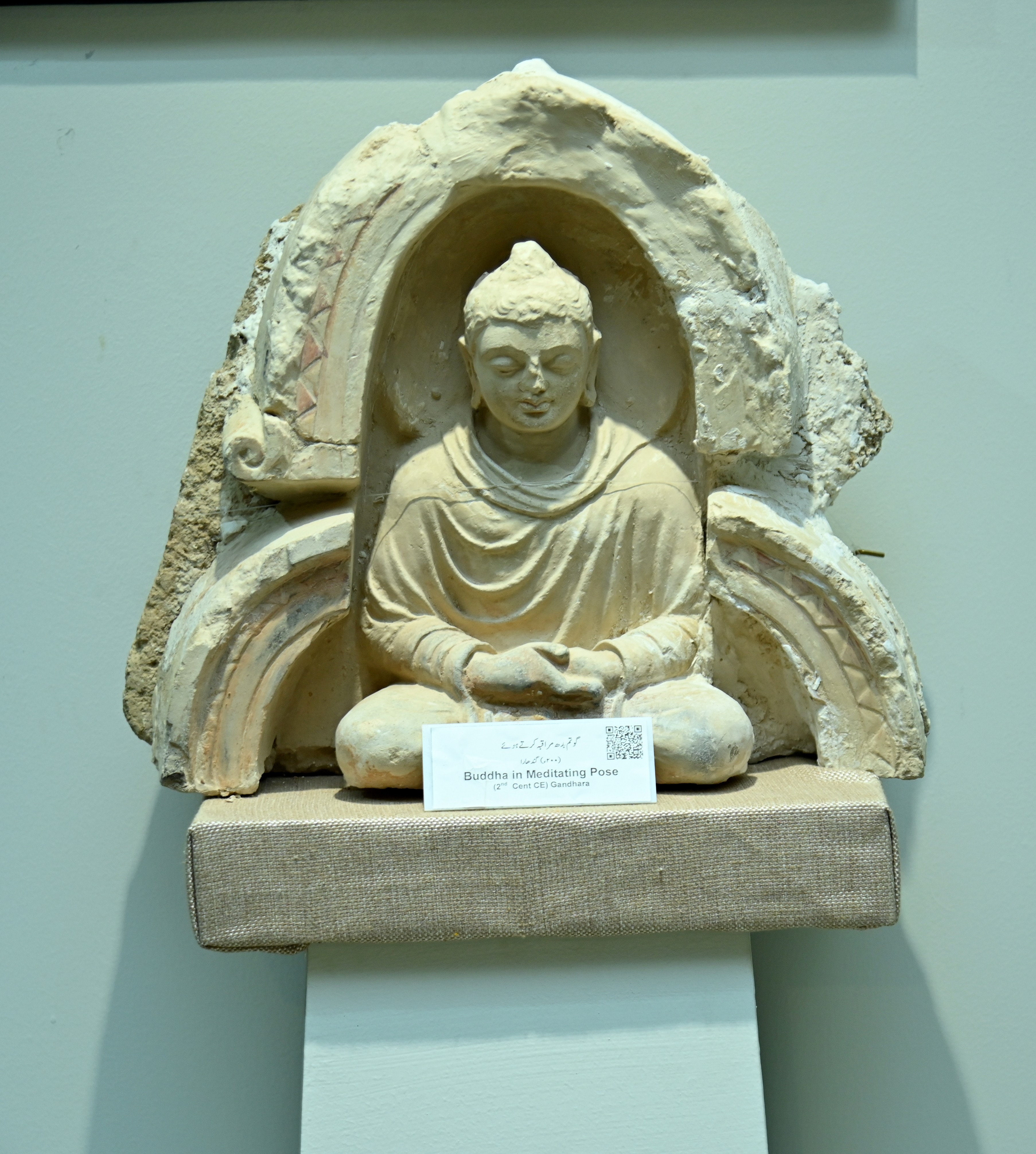 The statue of Buddha in meditating pose, 2nd Century CE, preserved in the Sir Syed Memorial Museum