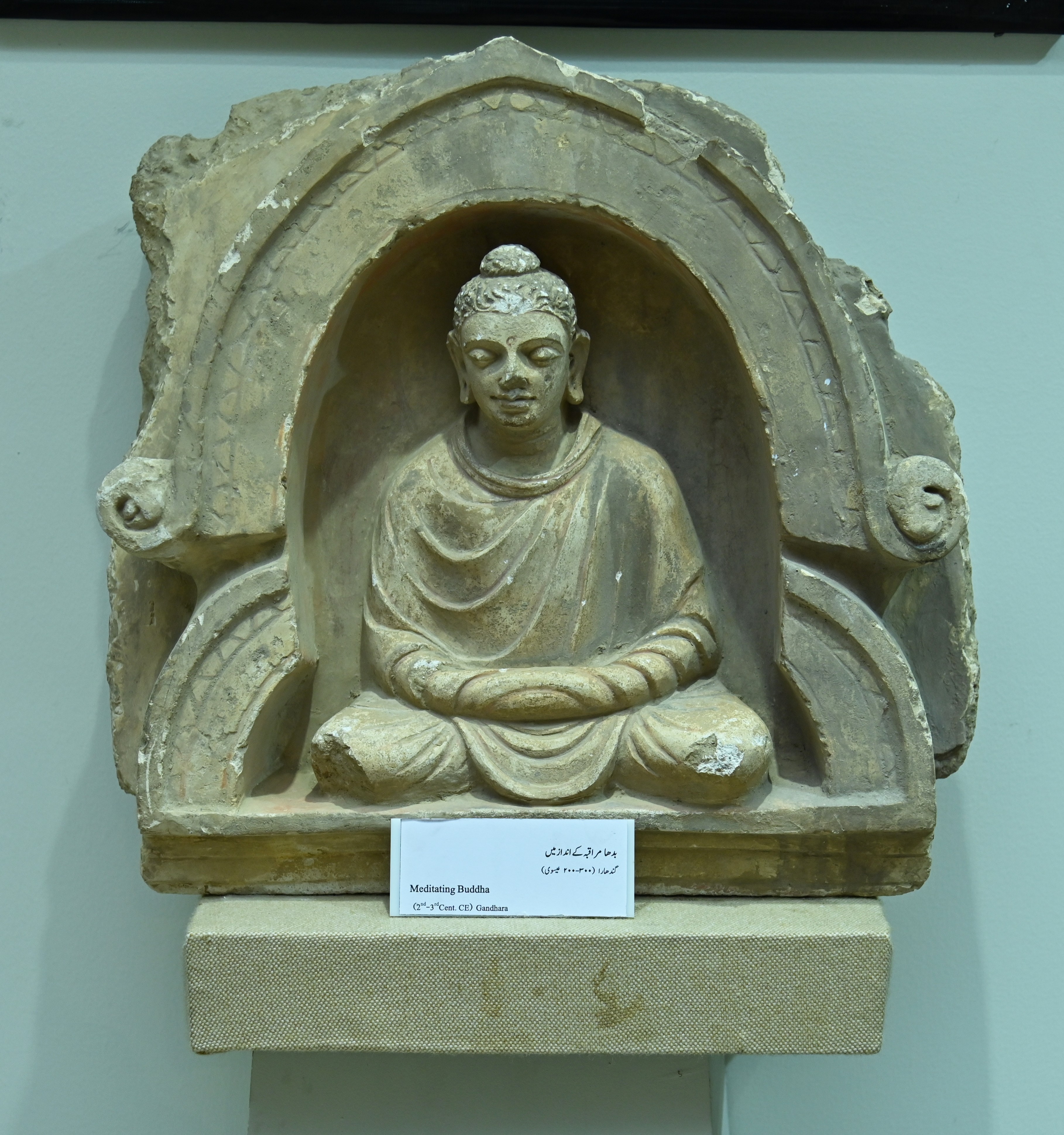 The statue of Buddha in meditating pose, 2nd-3rd Century CE, preserved in the Sir Syed Memorial Museum