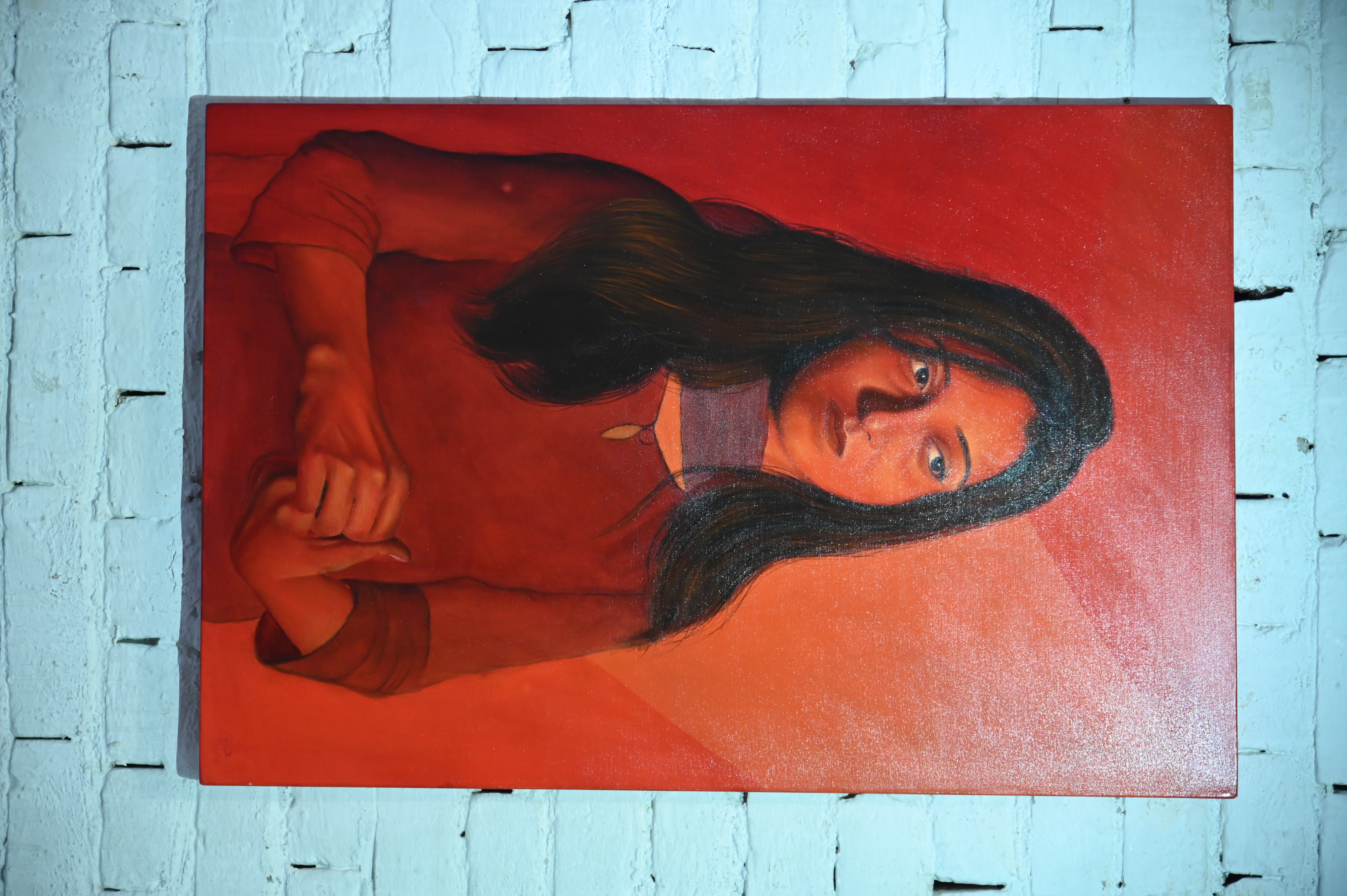 A beautiful painting of a young girl displayed at an Art Exhibition by Hussain Jamil at PNCA
