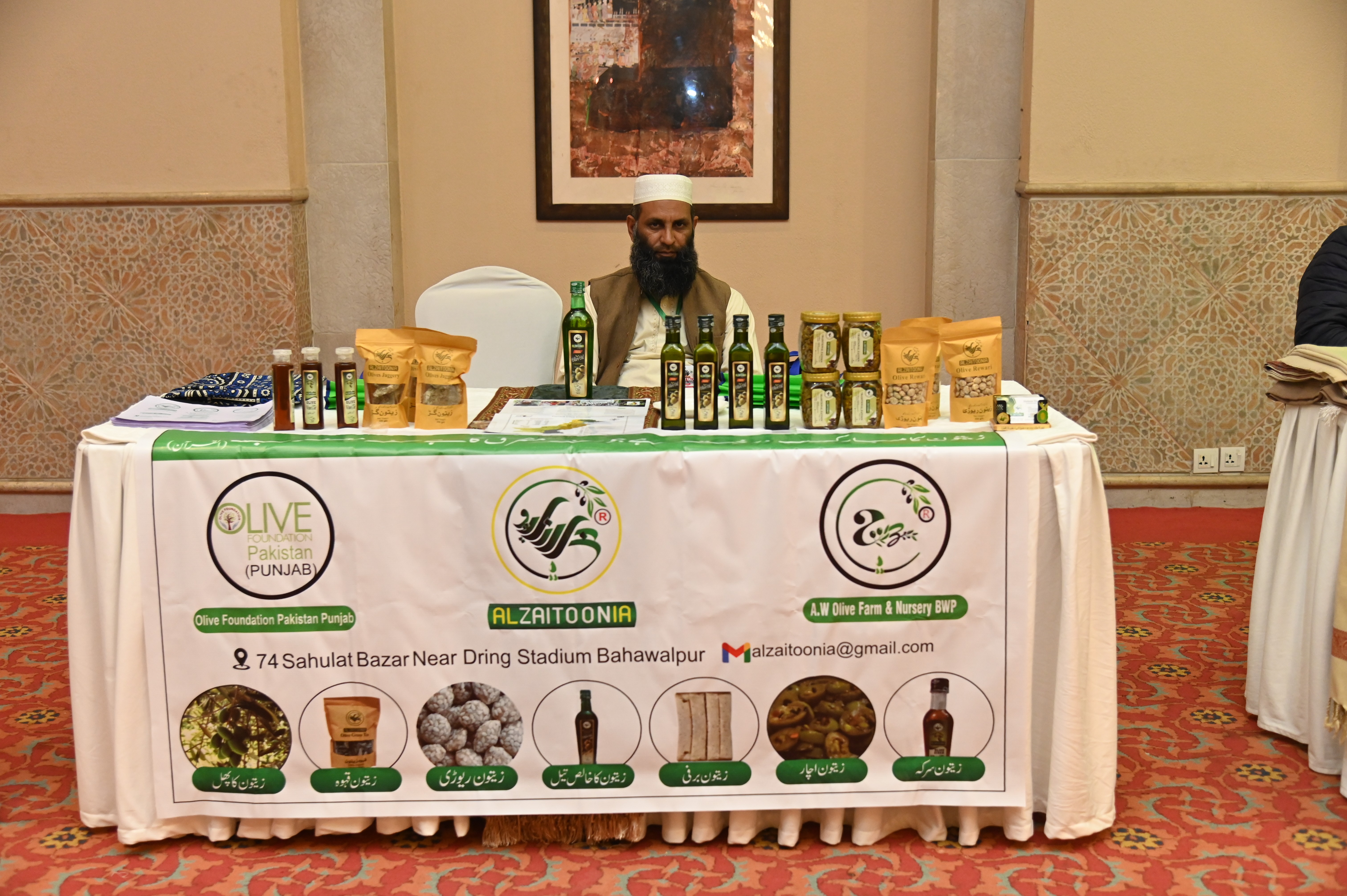 The stall of Alzaitoonia, selling olive oil and fresh olives