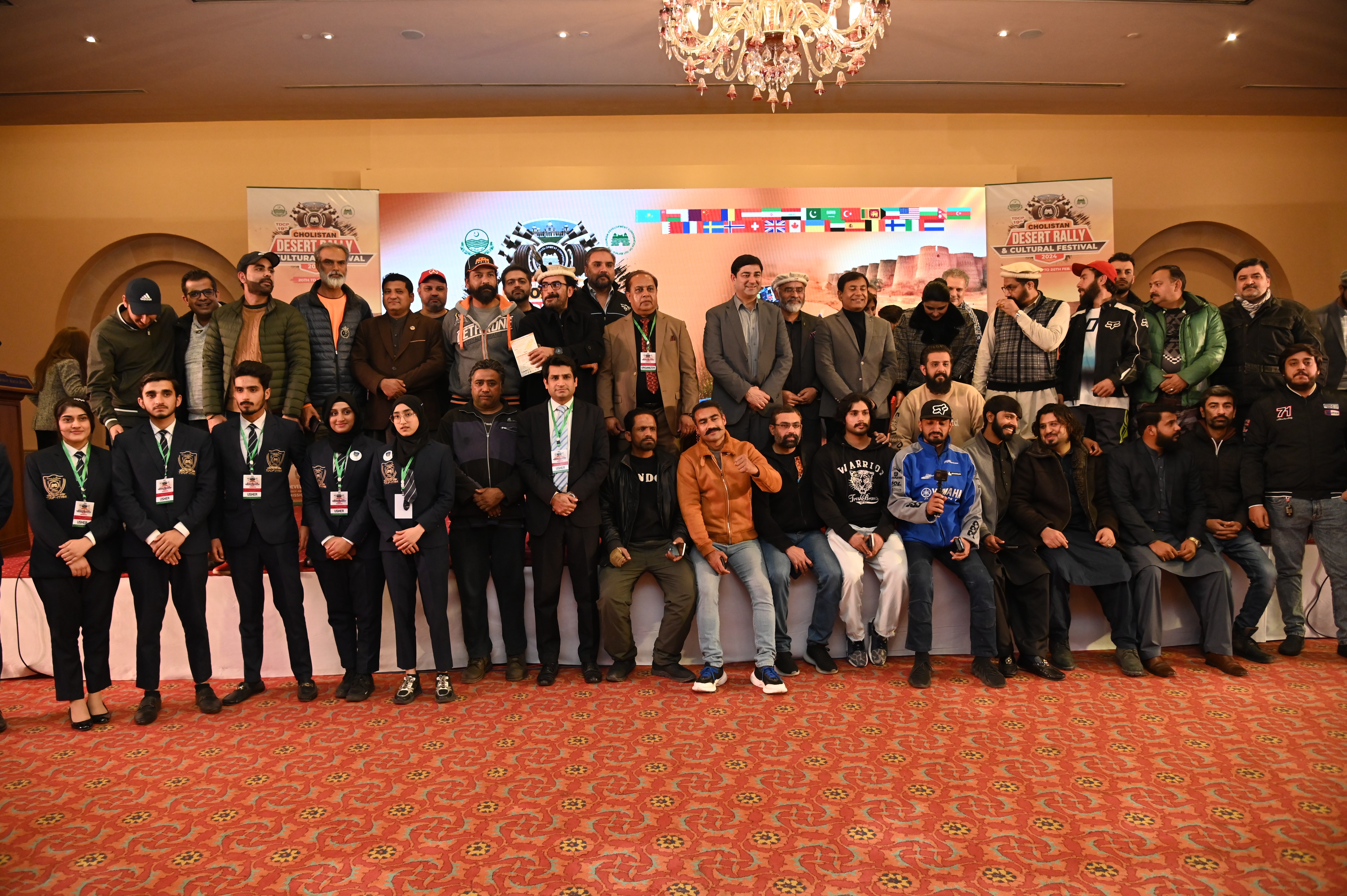 A group photo of chief guests, organizers and the participants