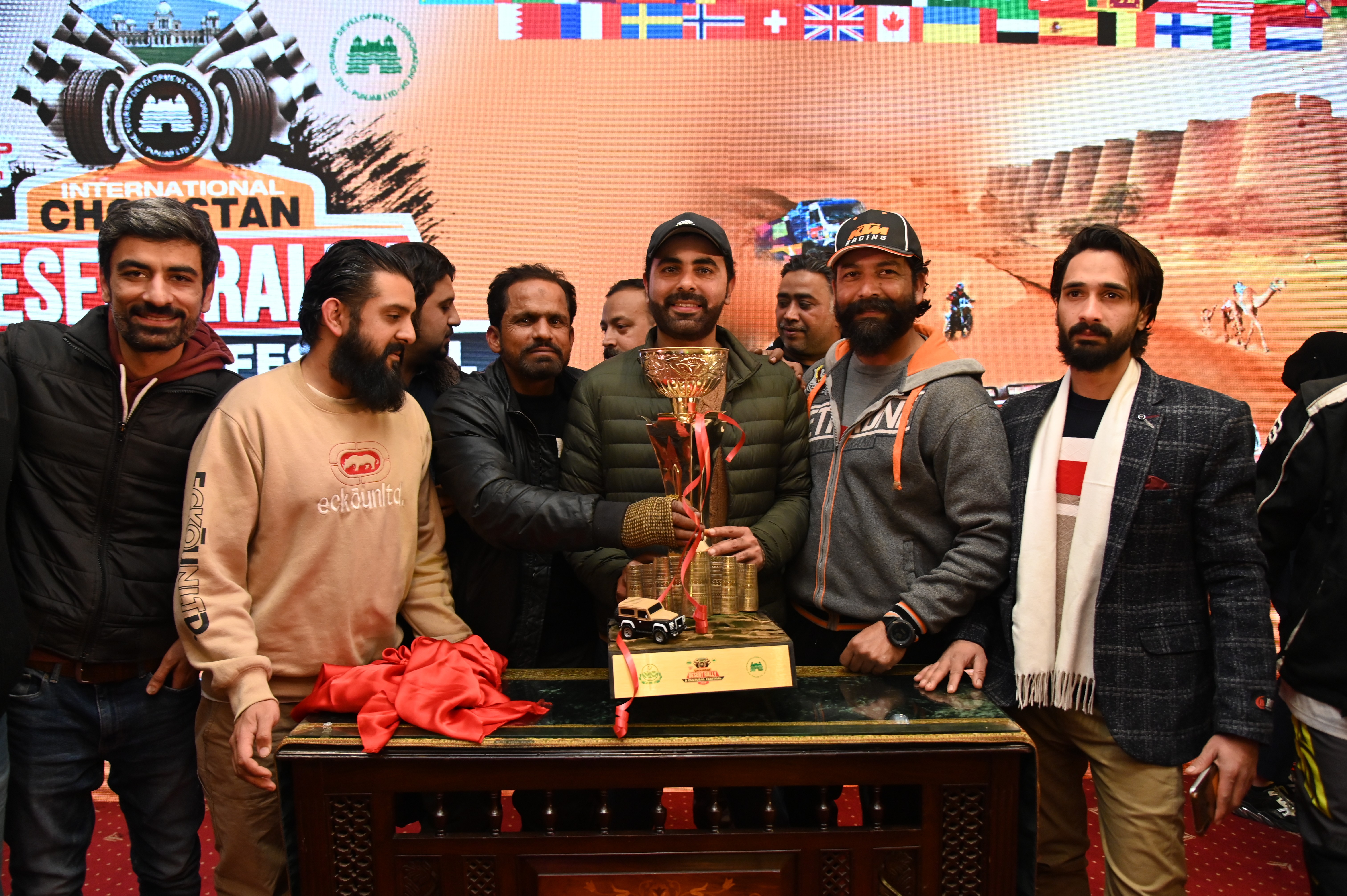 A group photo of  the participants with the trophy