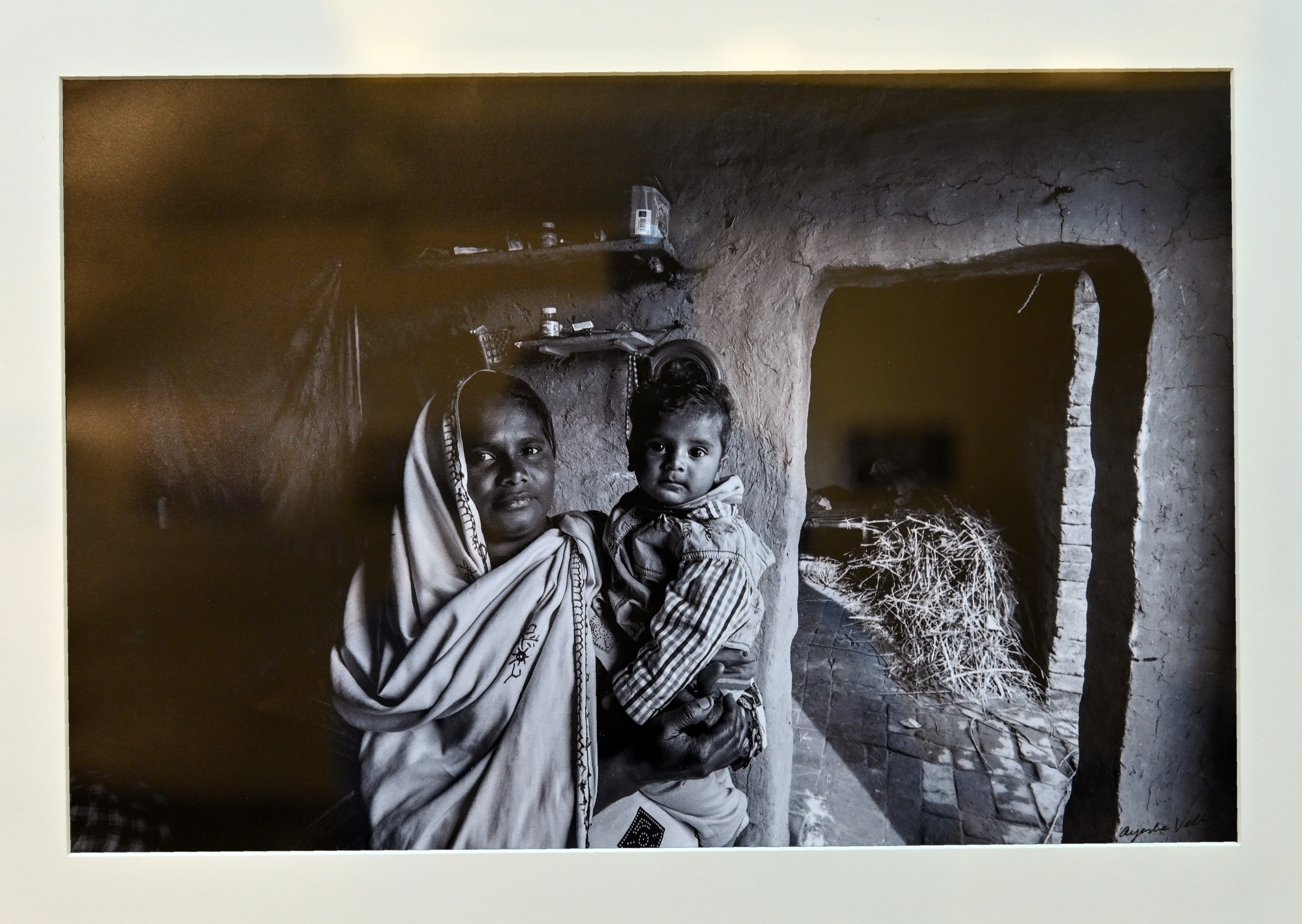 A picture of a mother with her son displayed at PNCA, under the theme of Retelling the Story of Pakistani Photographers’ Journey