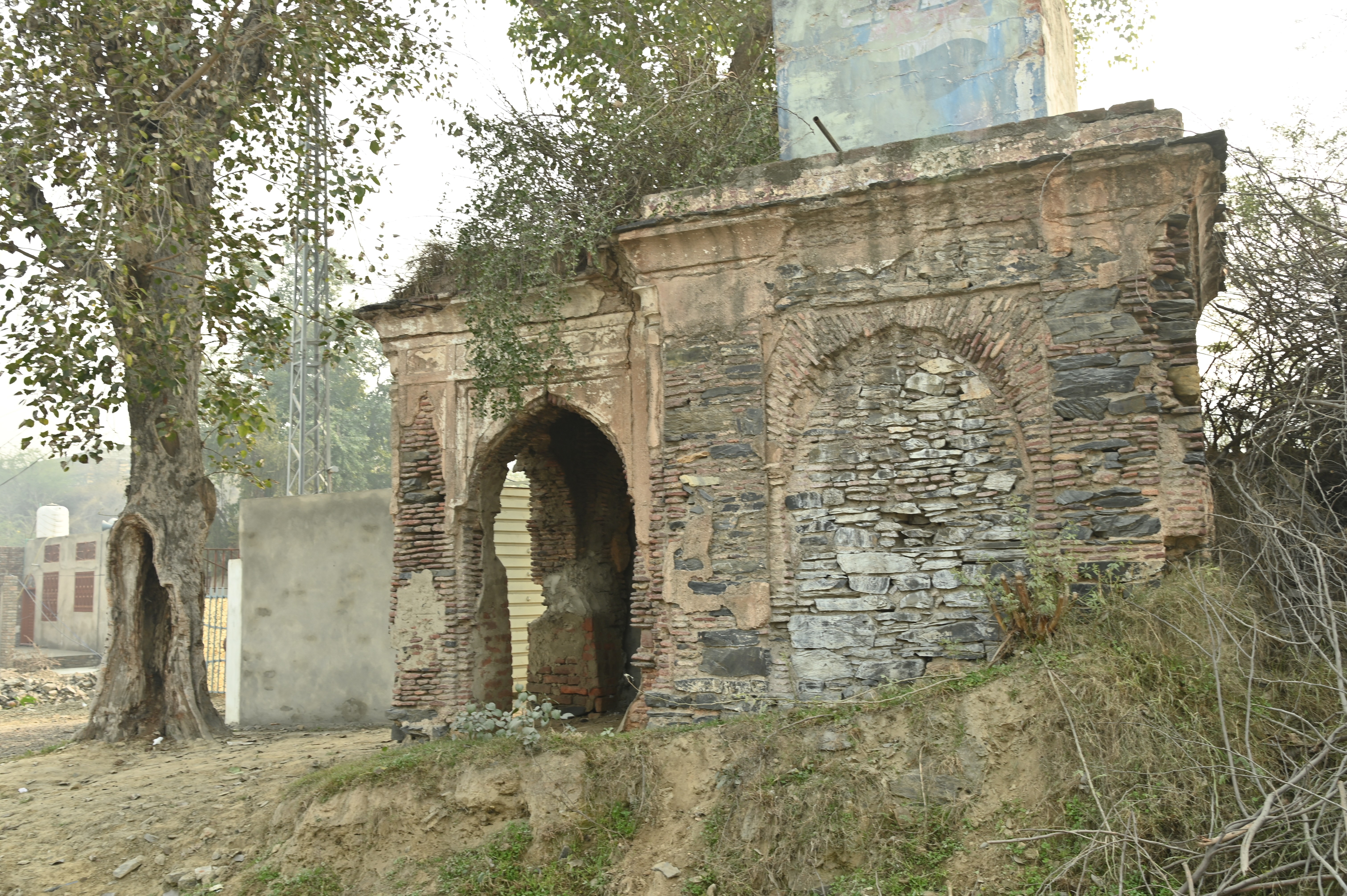 The deteriorated and crumbling beauty of the ancient structure near The Attock Tomb