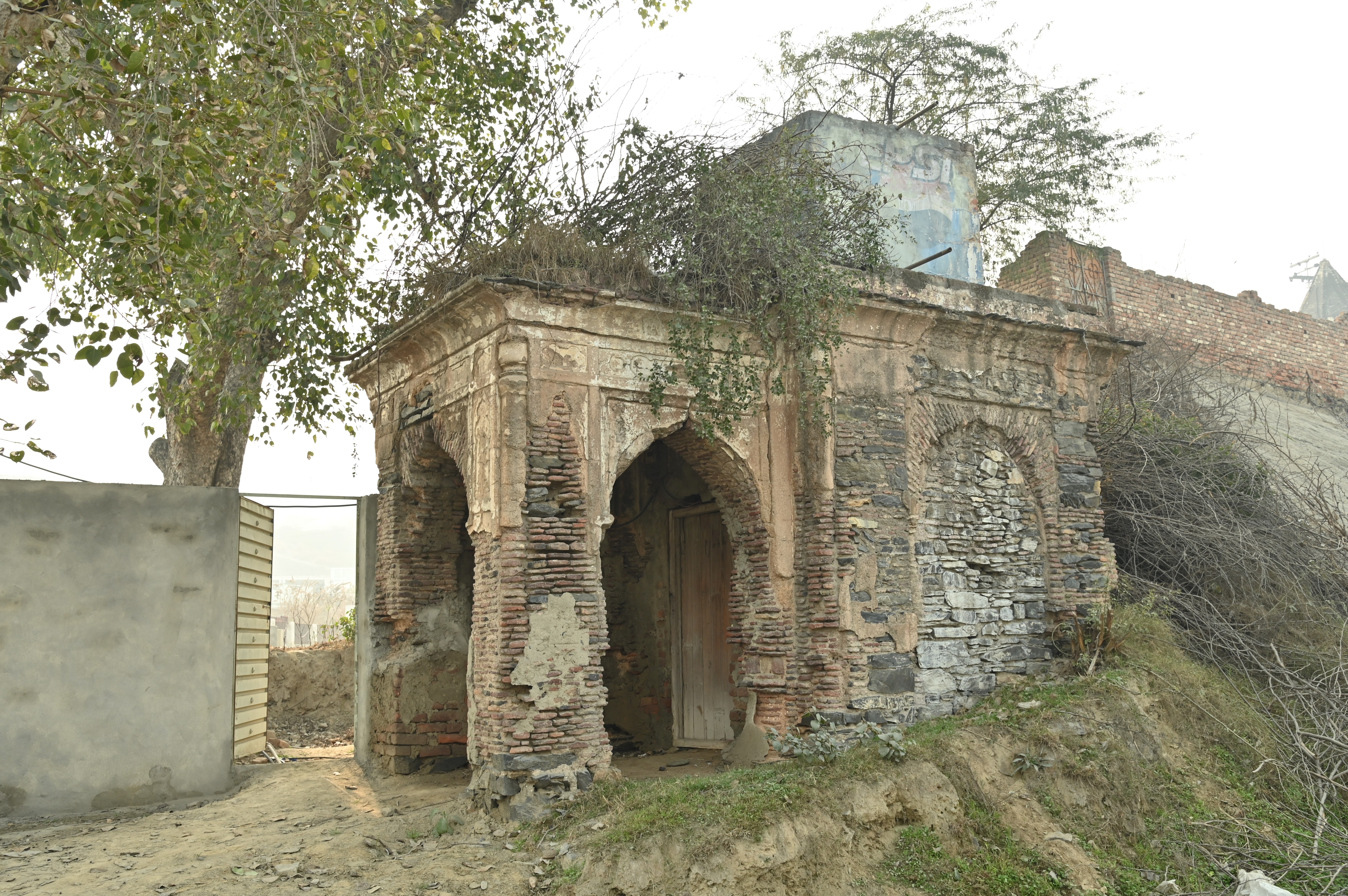 The deteriorated and crumbling beauty of the ancient structure near The Attock Tomb