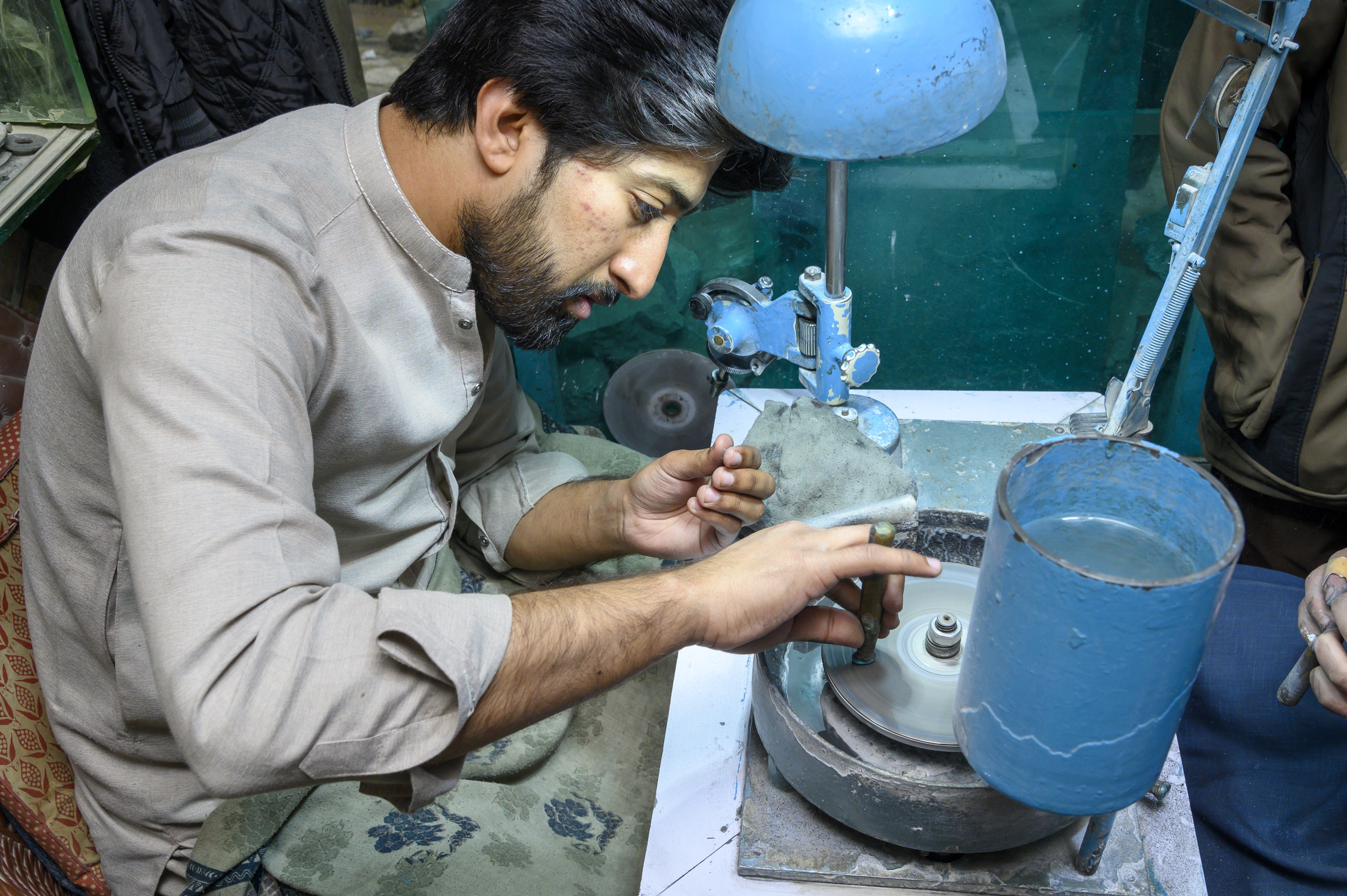 The Lapidarist busy in improving the quality of gemstones