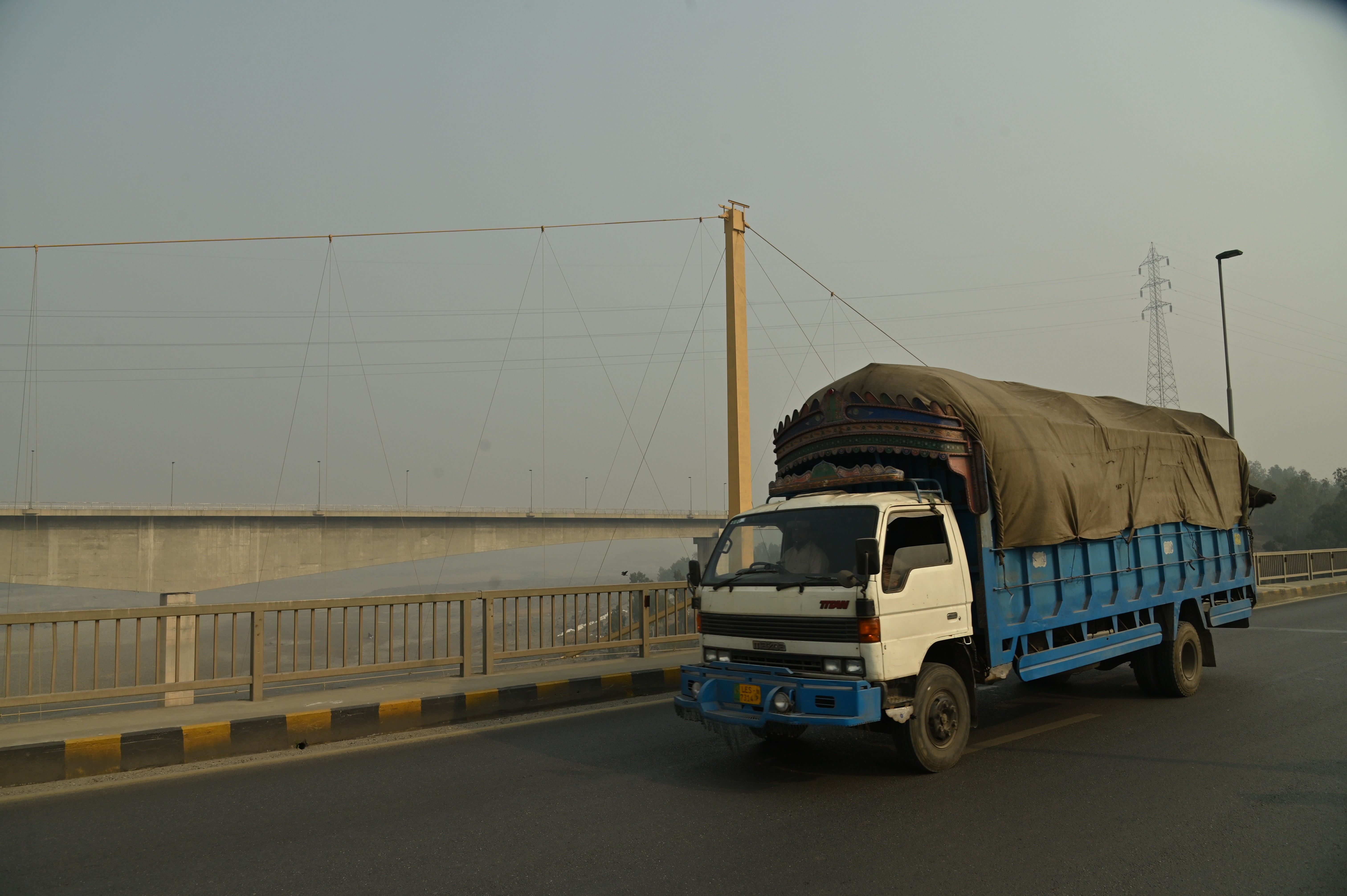 A truck passing by the bridge