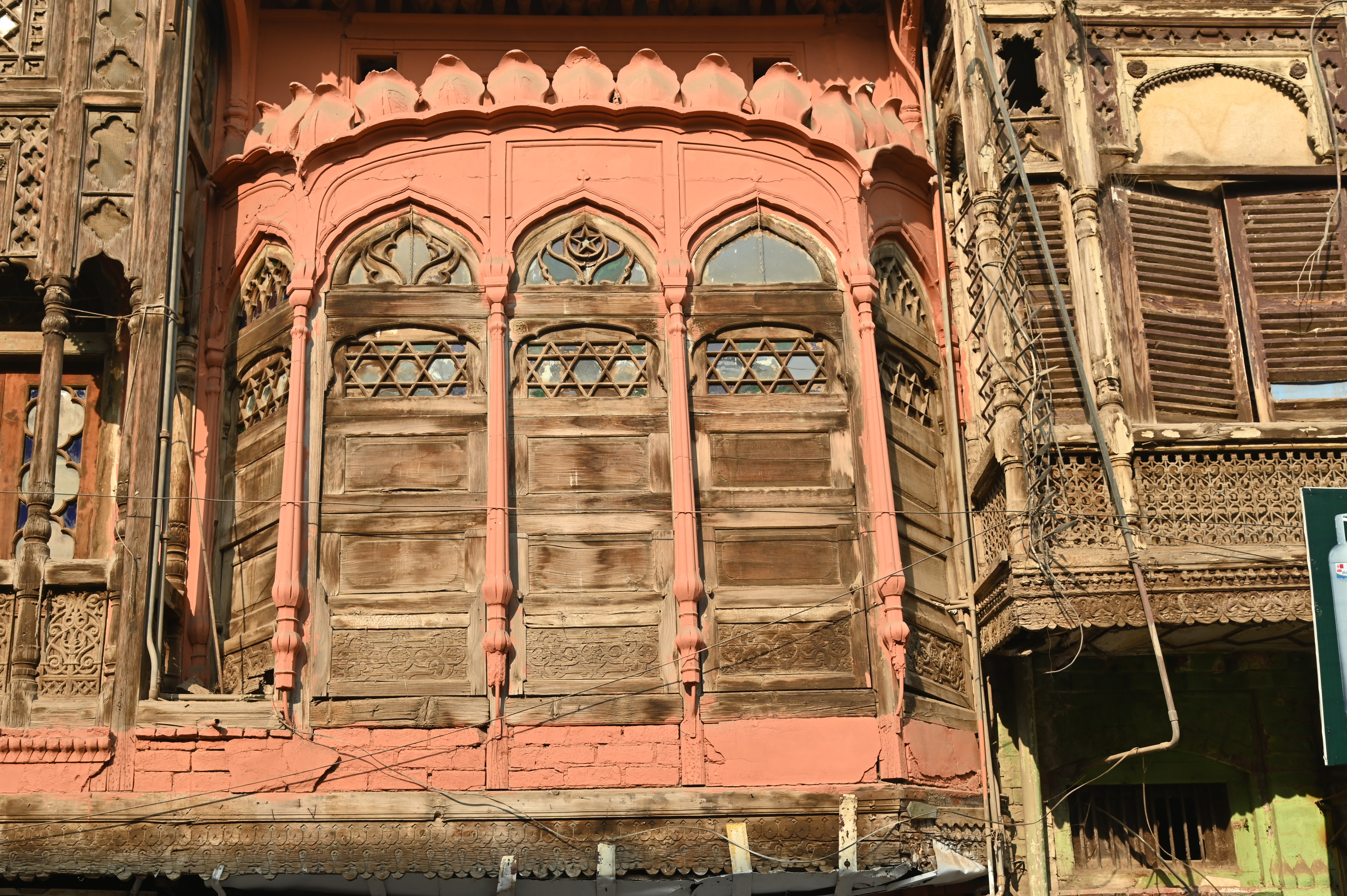 An old fashioned wooden window depicting the ancient culture