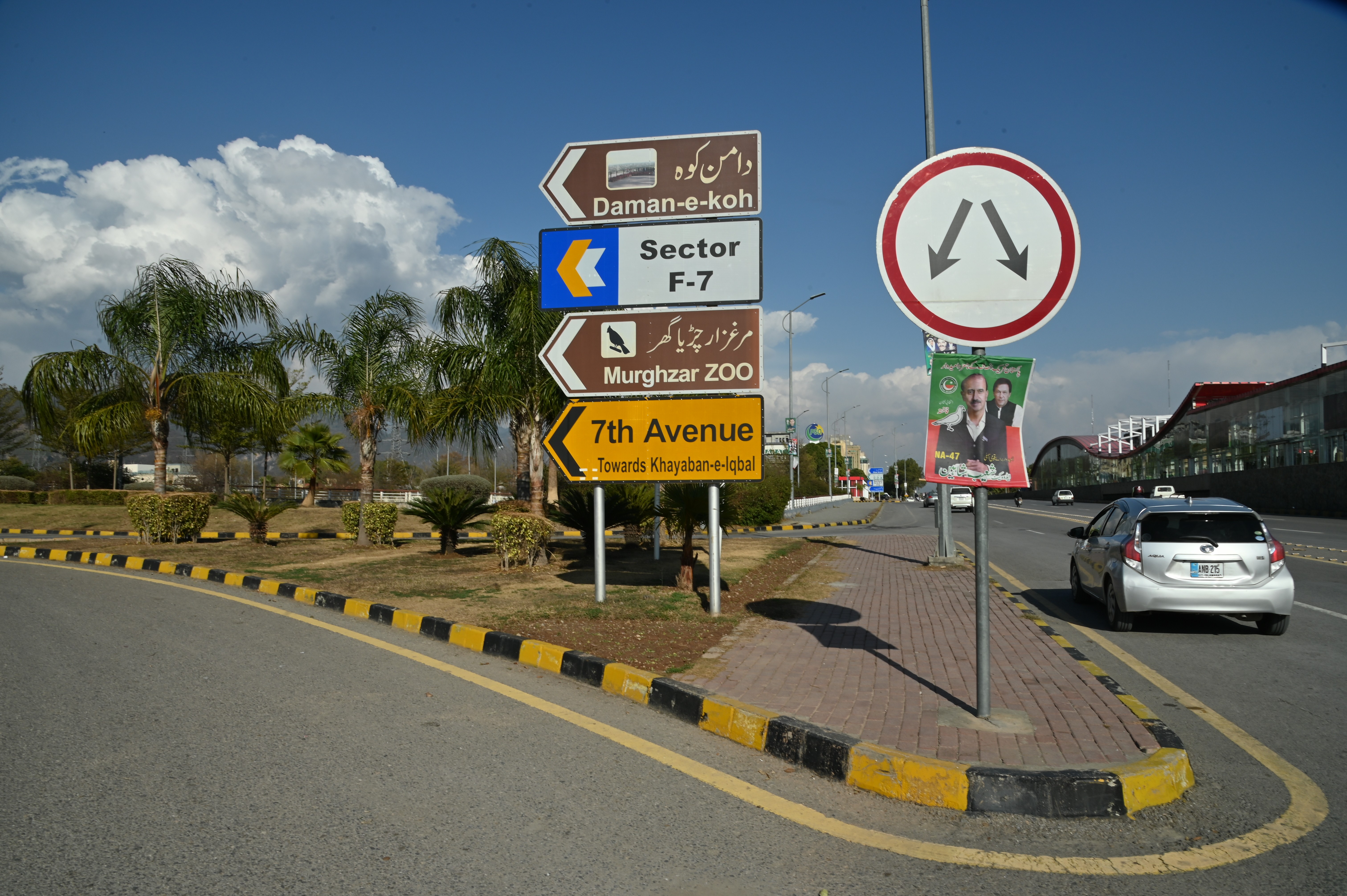 A board displaying directions of various locations in Islamabad