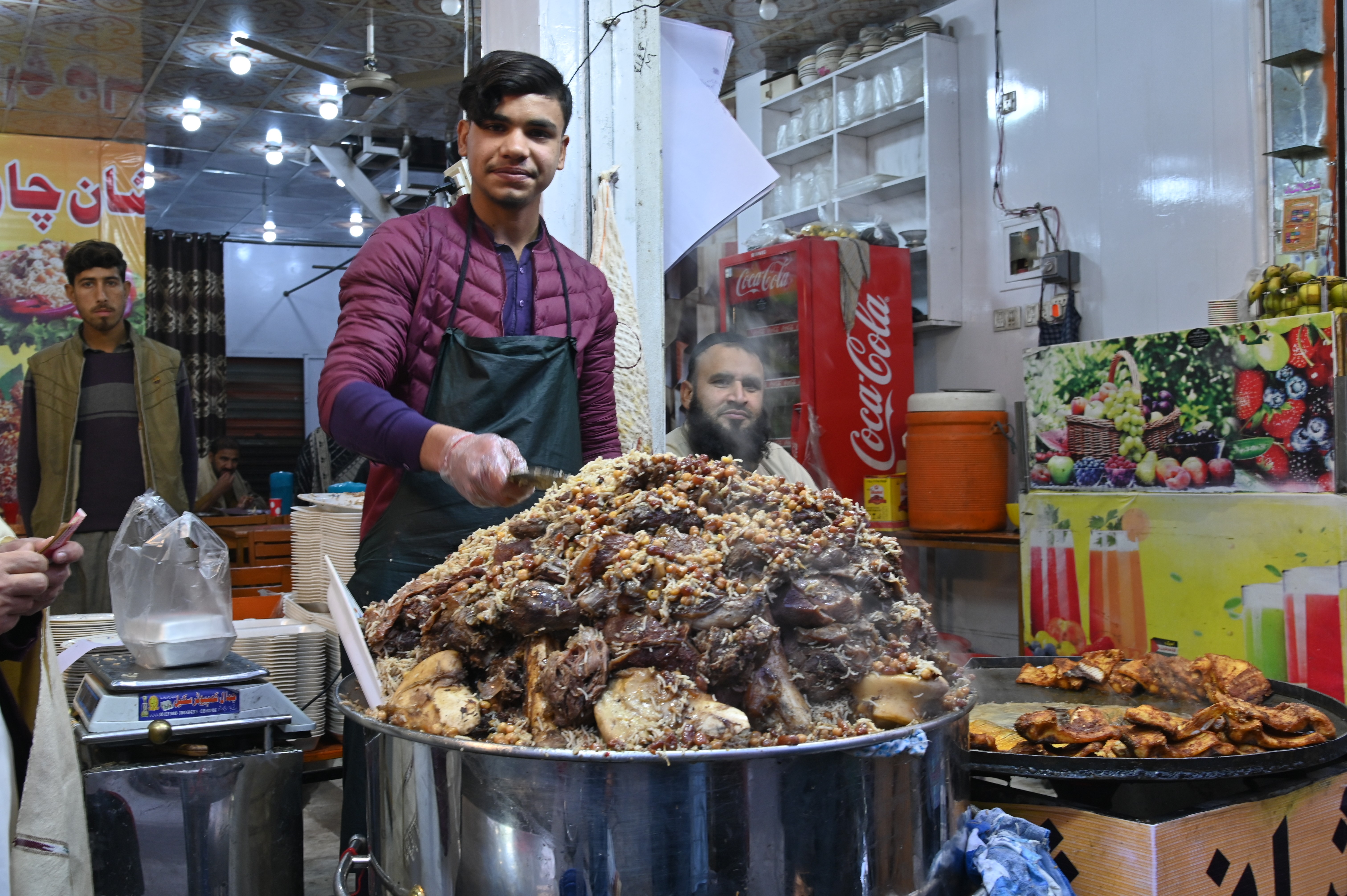 A boy selling Kabuli Pulao, The Afghan National Dish