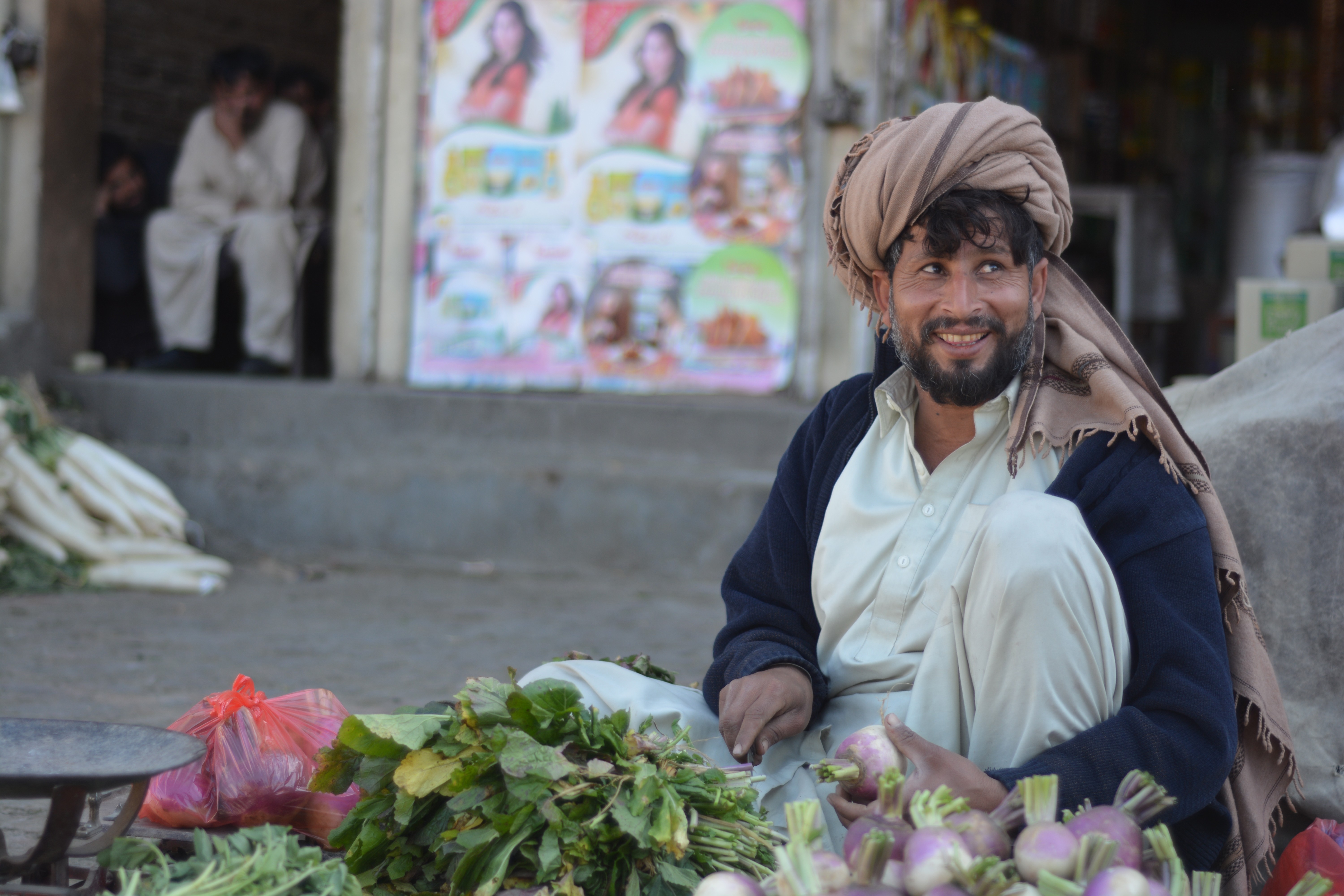 A man selling fresh vegetables