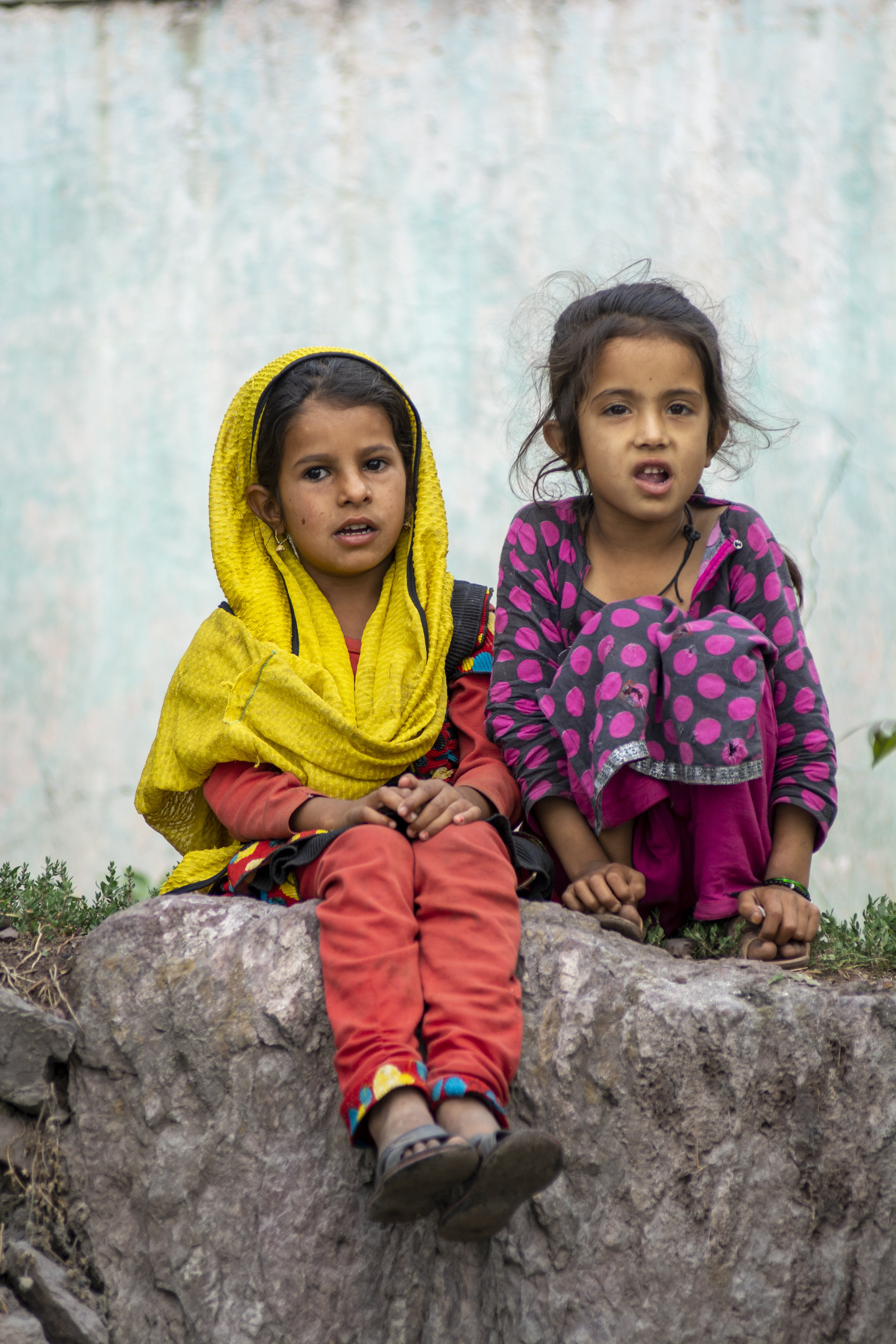 Two girls sitting in the remote areas