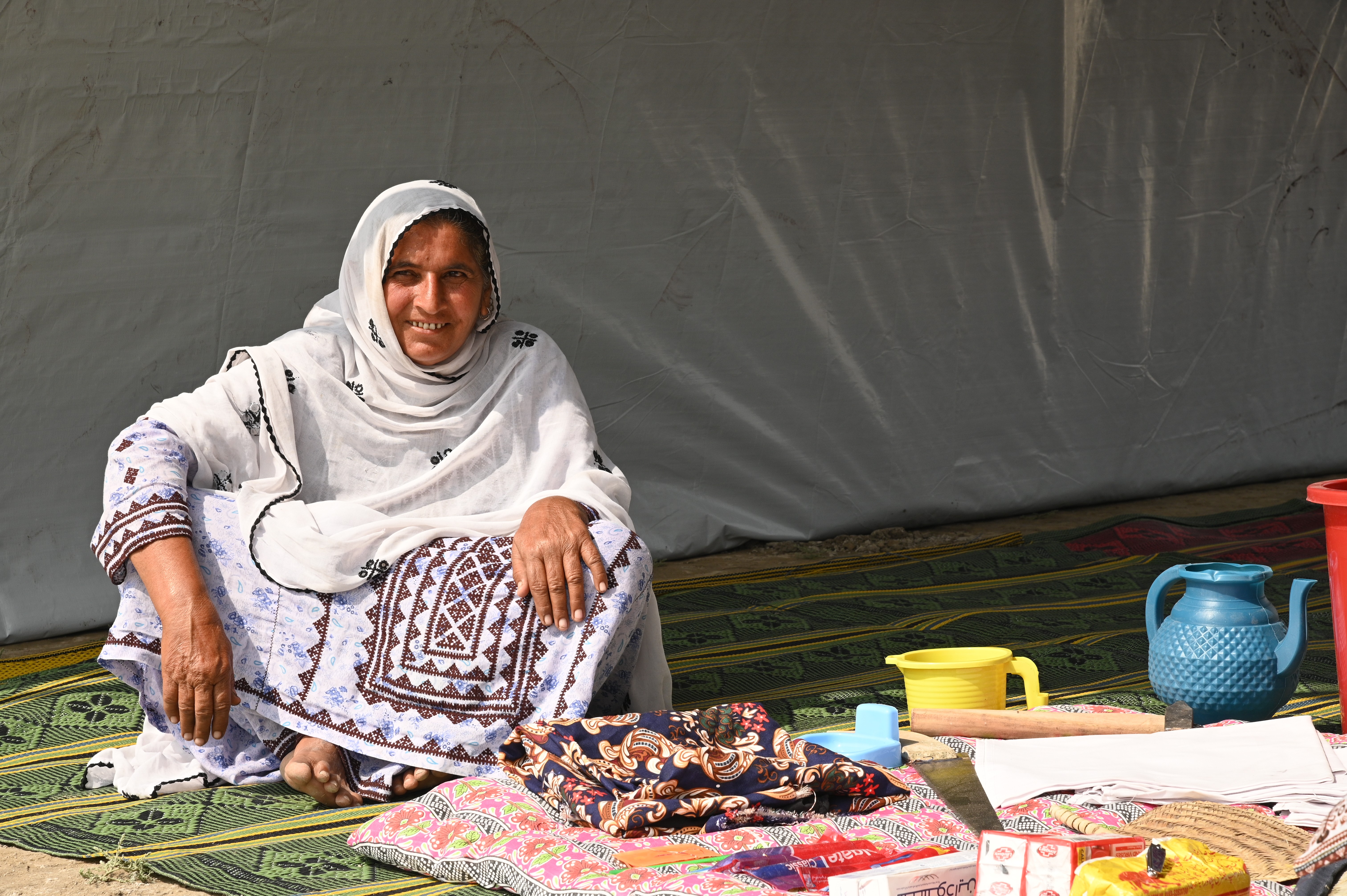 A women sitting inside a camp
