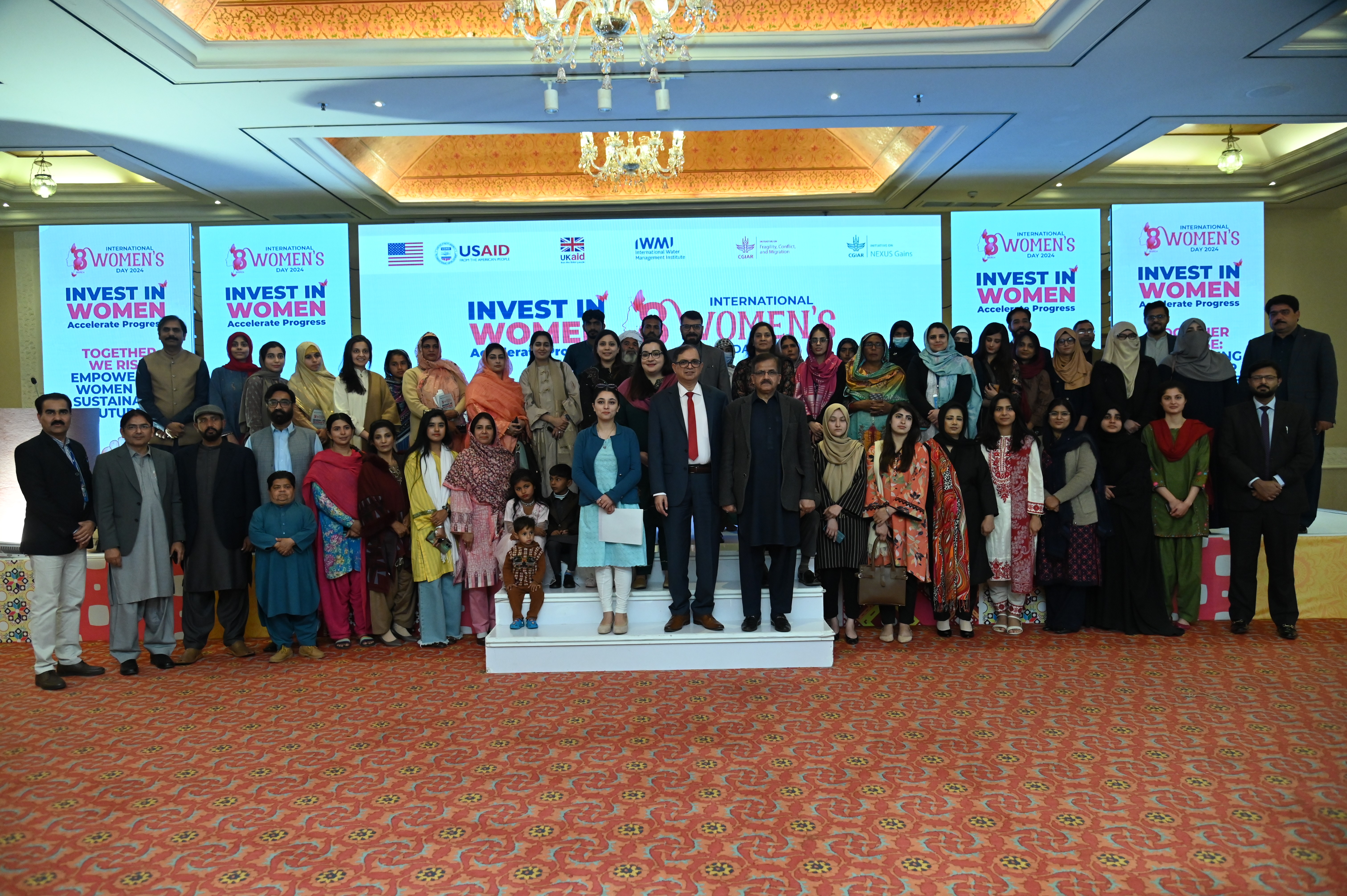 The group photo of the participants and the chief guests at the International Women's Day