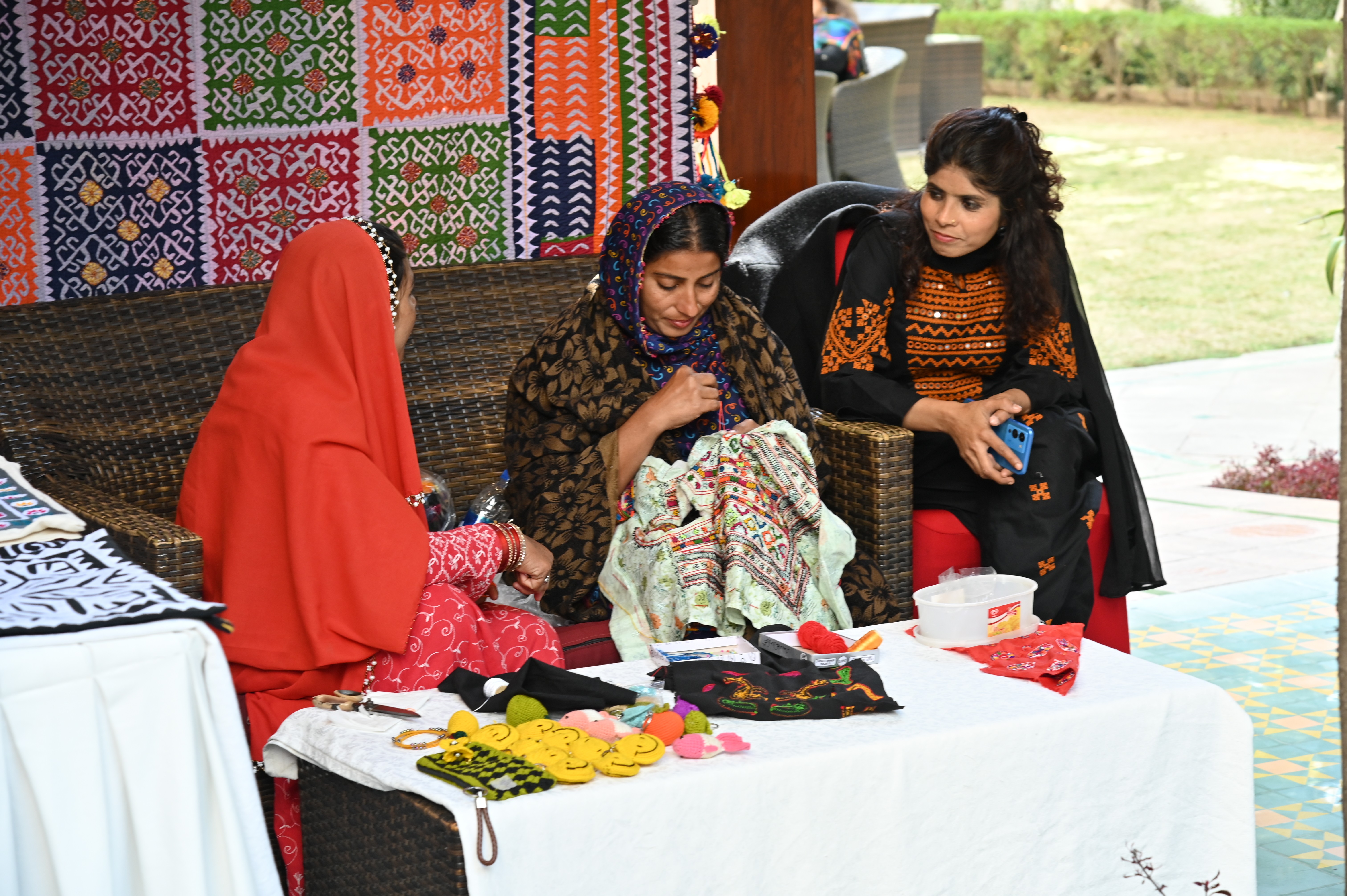 The young girls busy with embroidery work