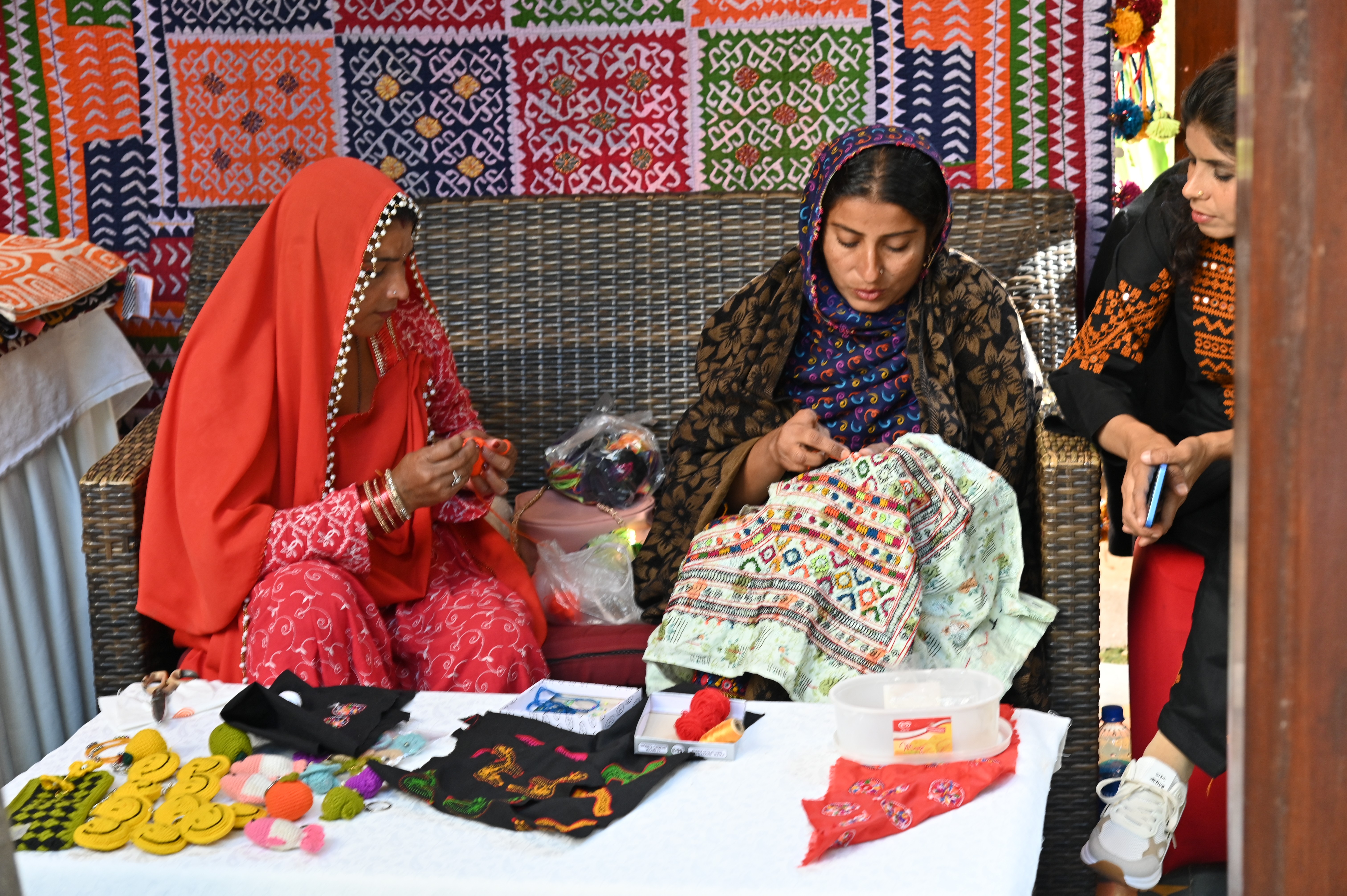 The young girls busy with embroidery work