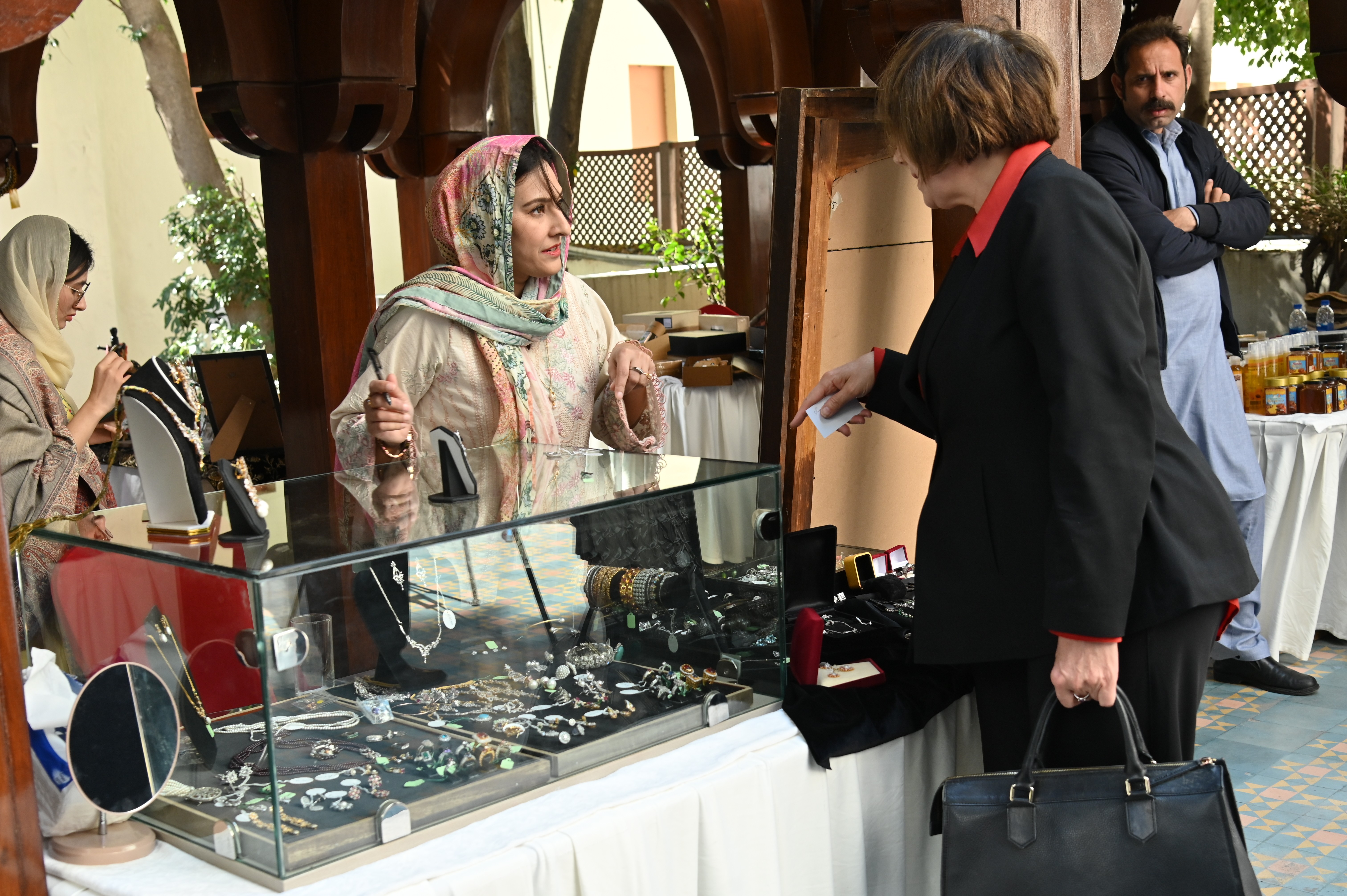 A woman selling beautiful jewelry at the Crafts Festival