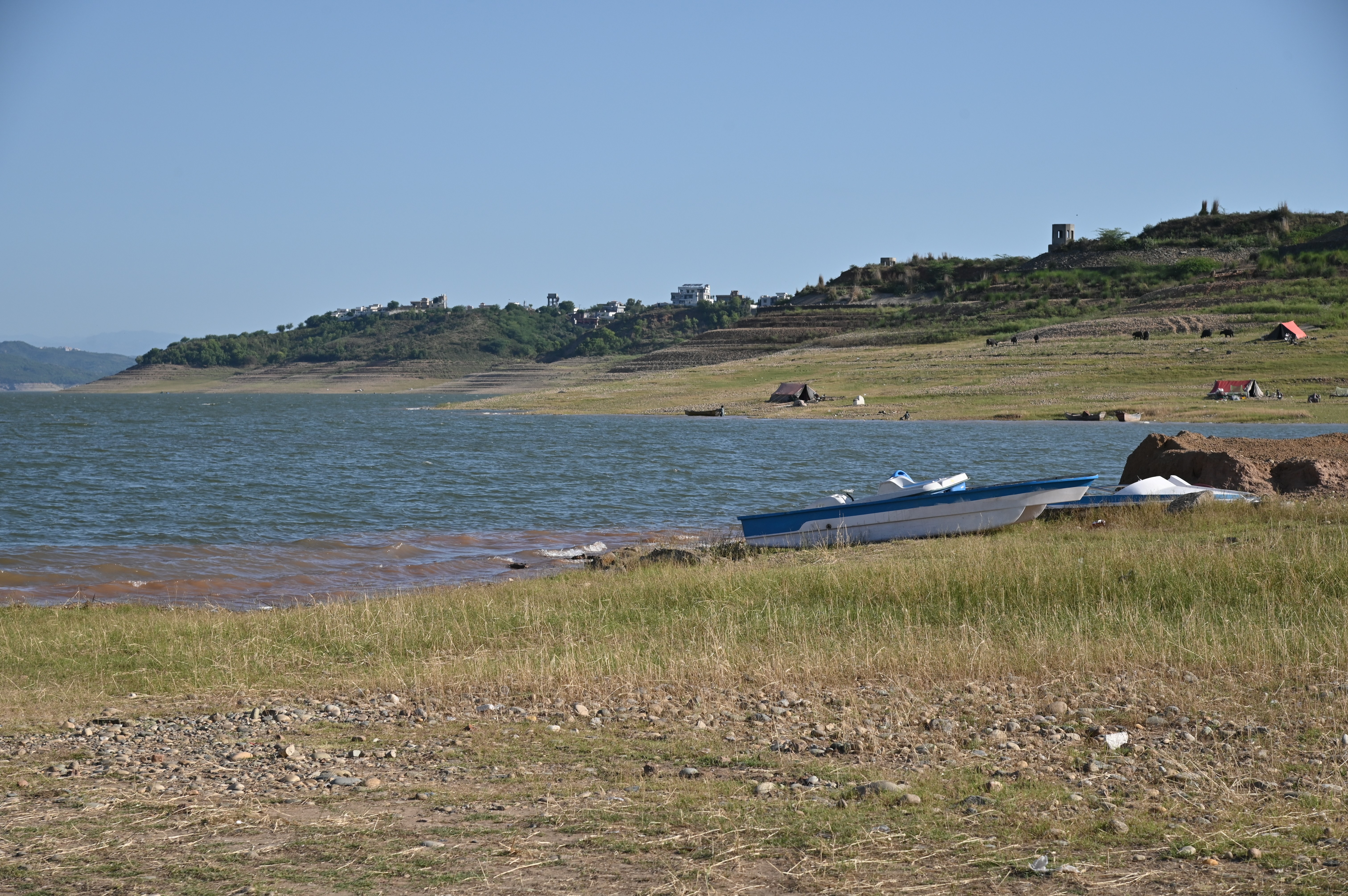 The boats on the side of lake