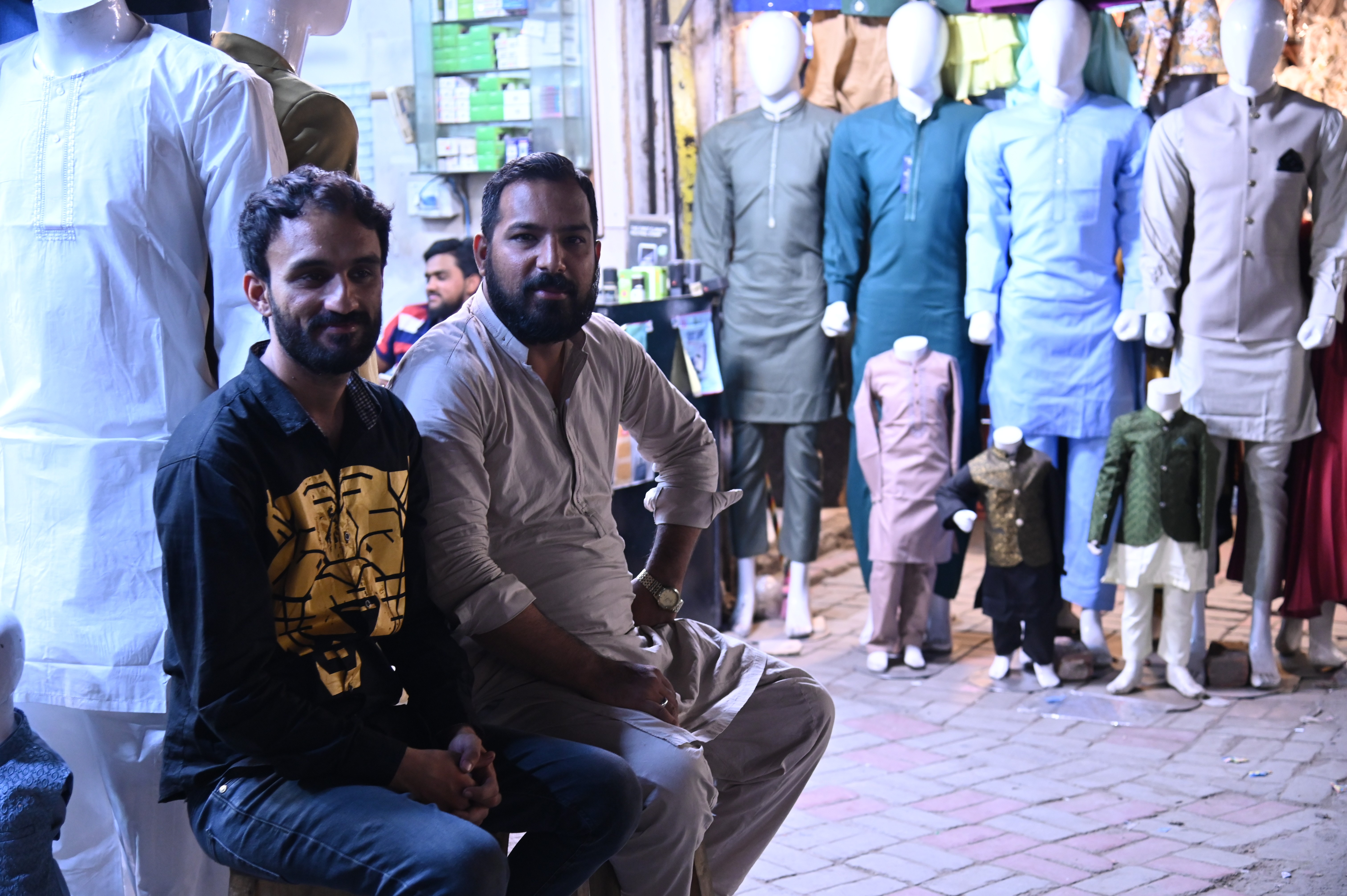 Men sitting in market