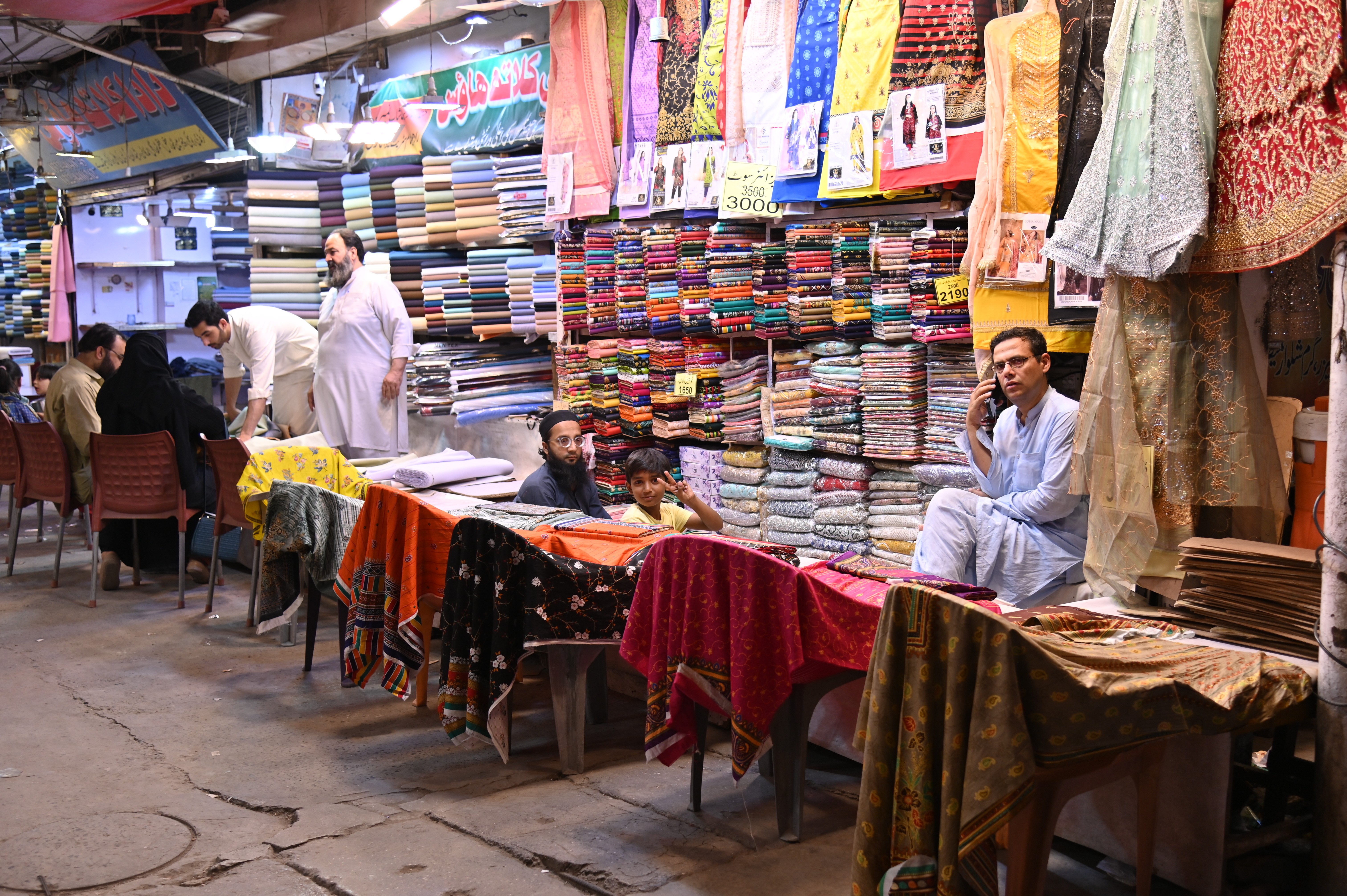 Men selling unstitched women clothes