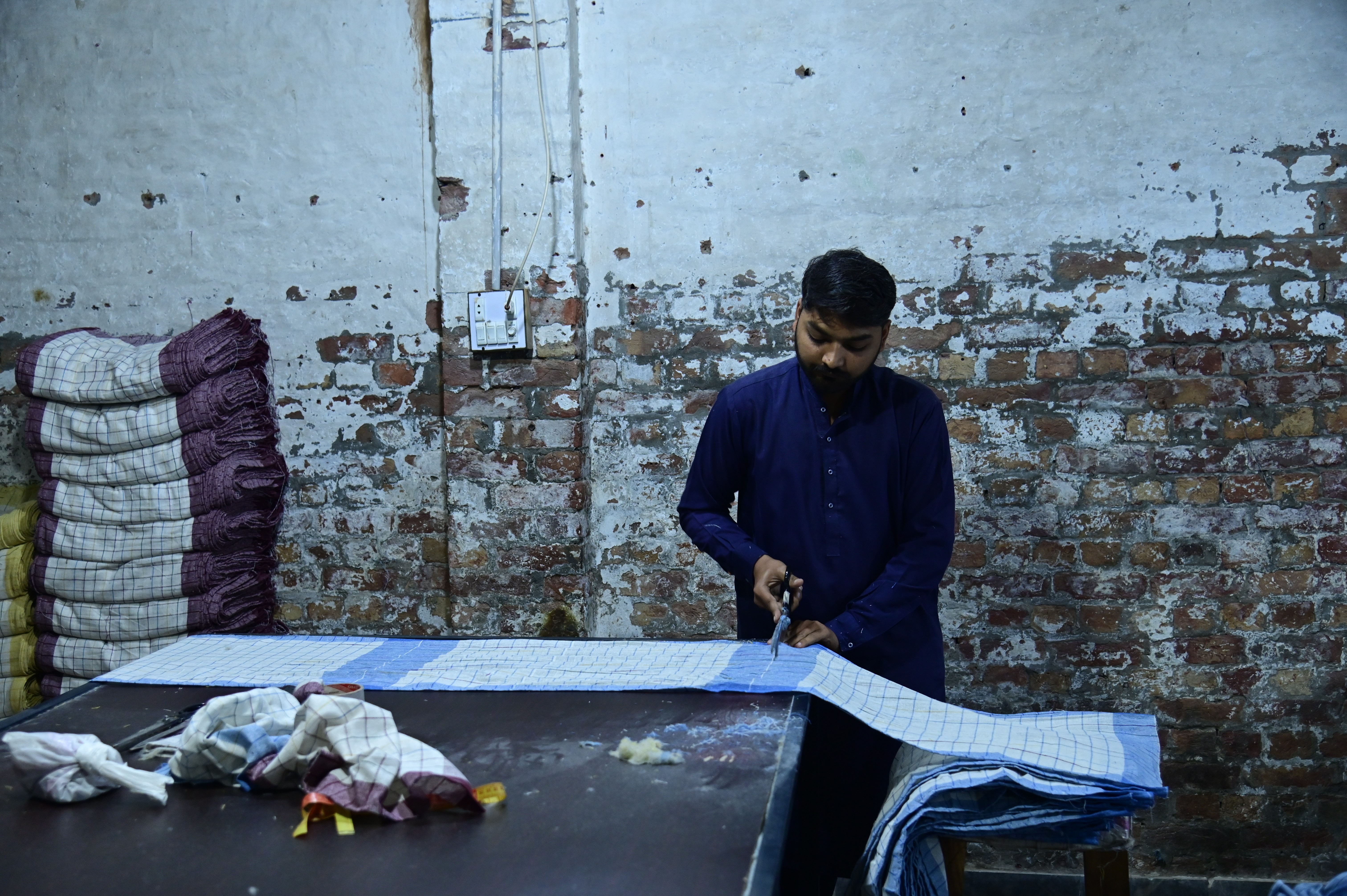 Workers busy in sewing handkerchieves