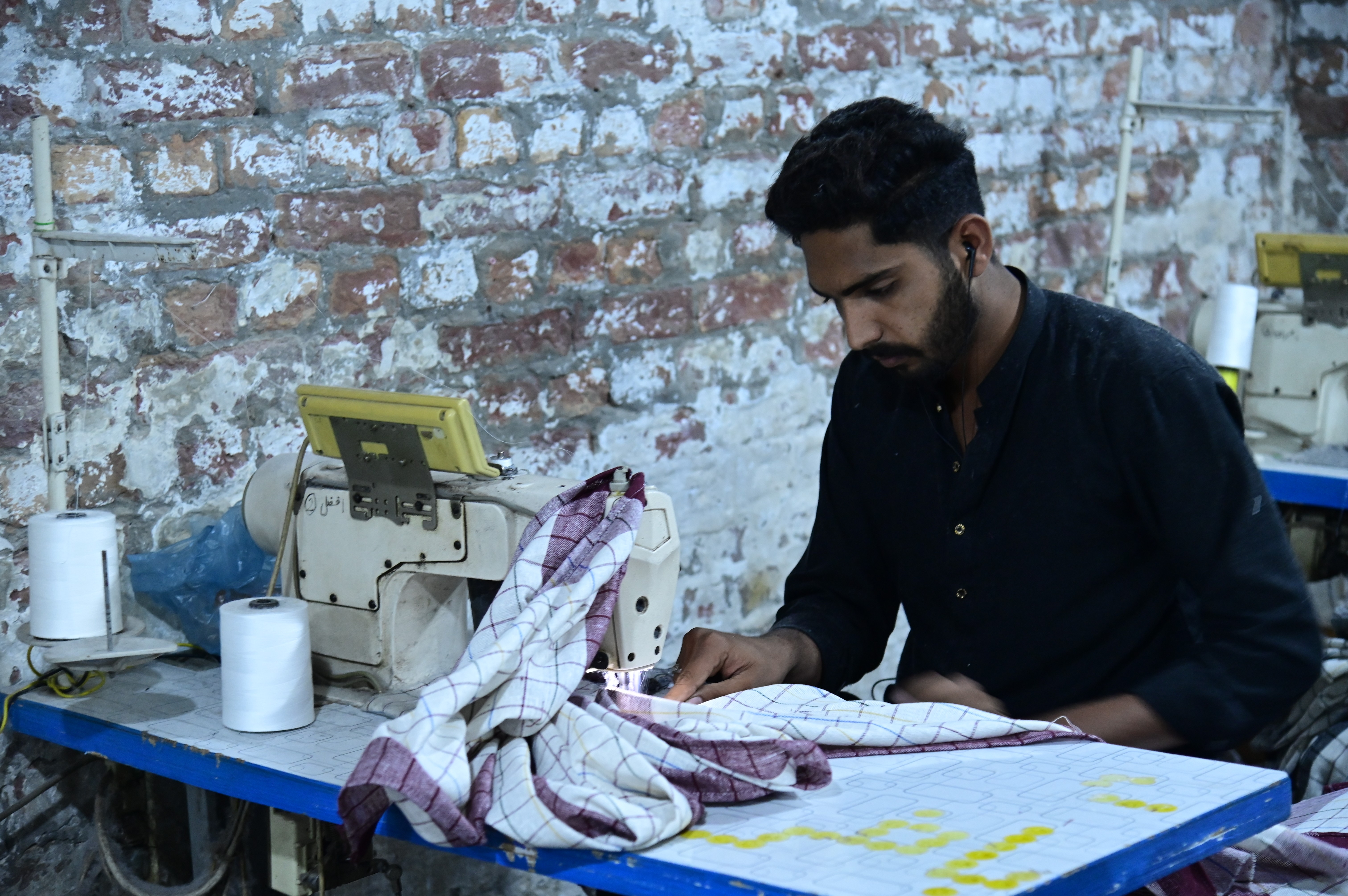 Workers busy in sewing handkerchieves