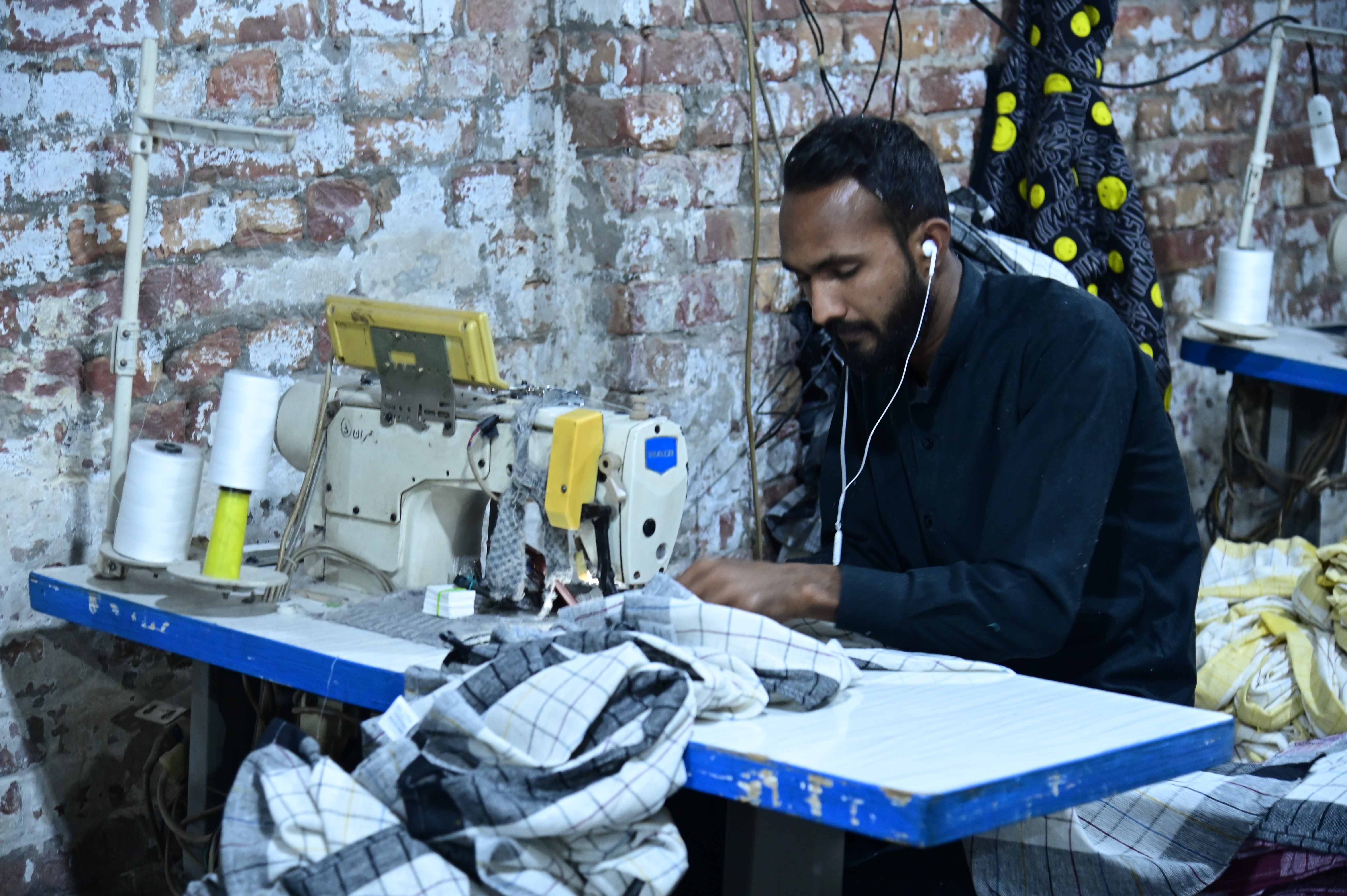 Workers busy in sewing handkerchieves
