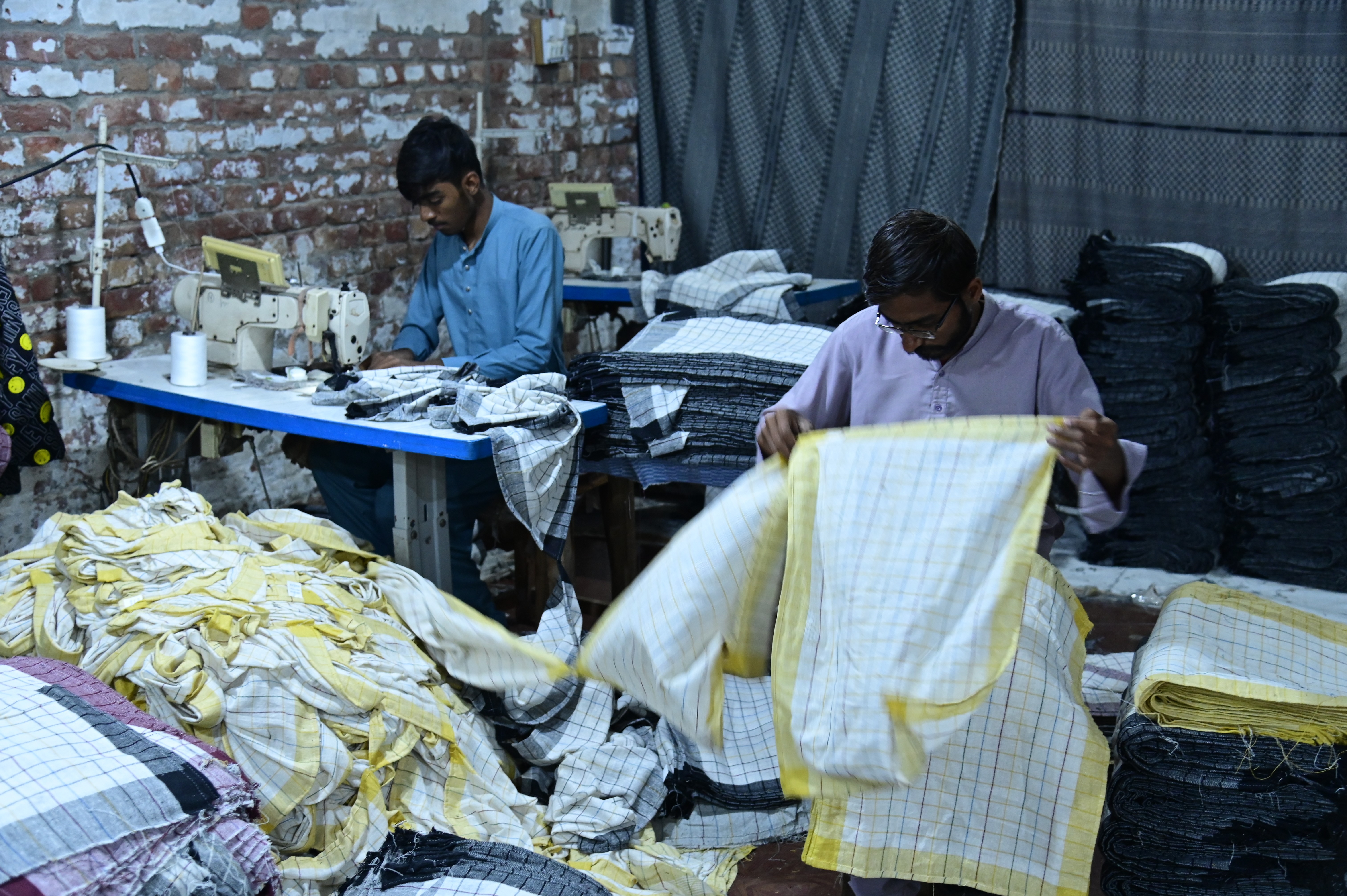 Workers busy in sewing handkerchieves