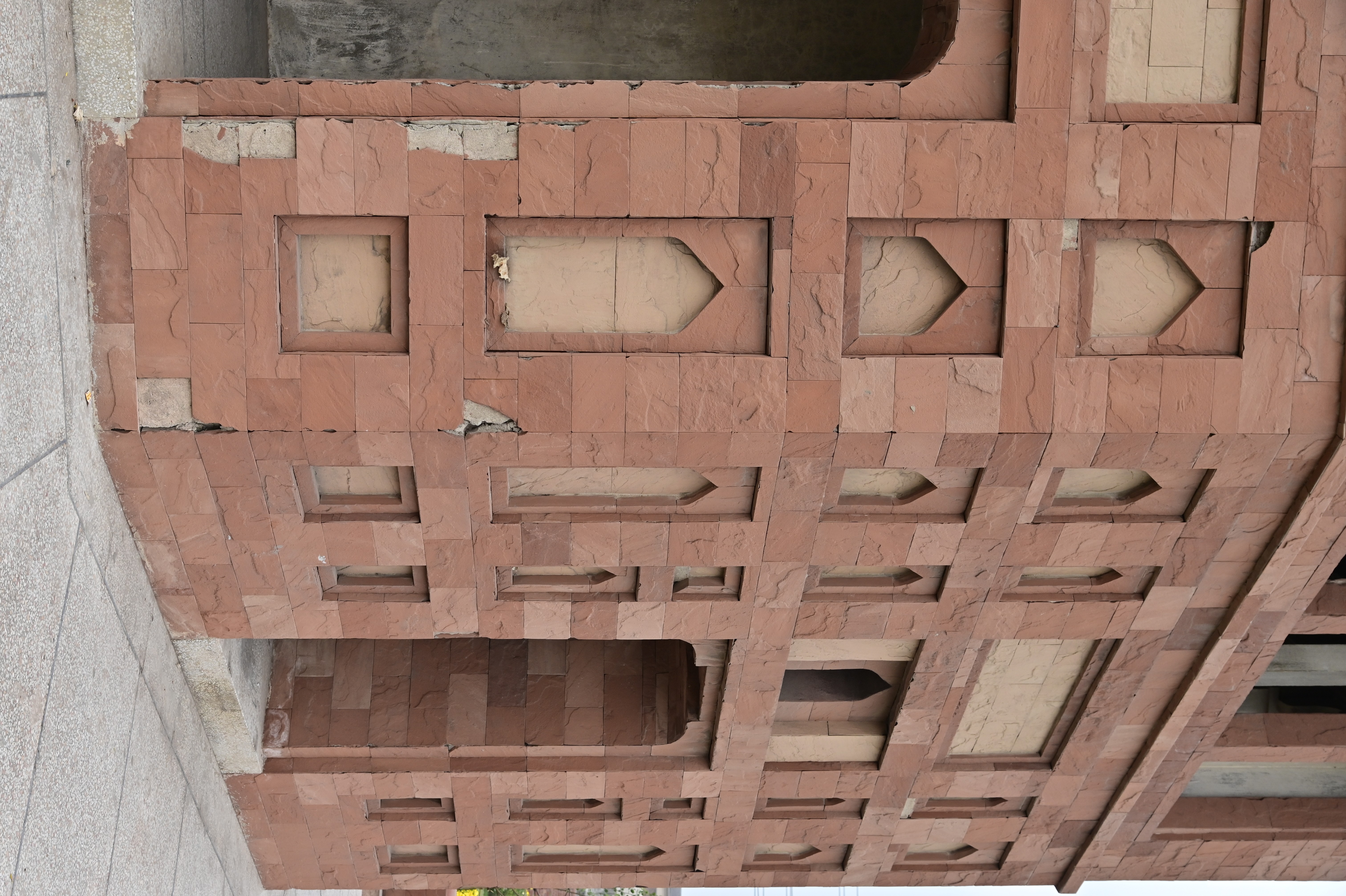 Historical red sandstone monument with intricate Mughal-era design