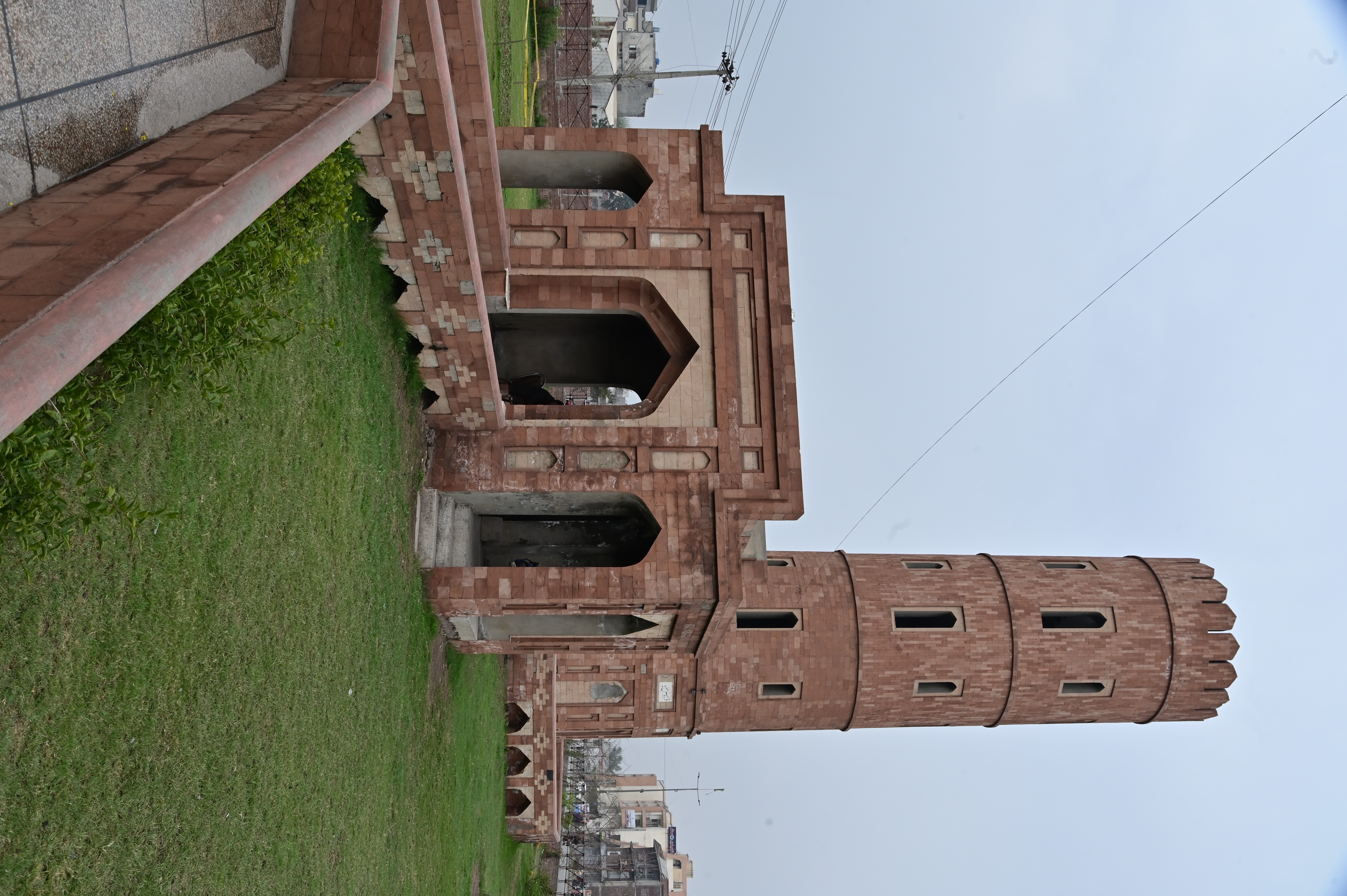 Historical red sandstone monument with intricate Mughal-era design