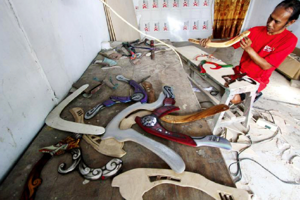 Photo taken on Aug. 22, 2022 shows airbrush boomerang crafts displayed at a workshop in Bendungan village, Sragen district, Central Java, Indonesia. (Photo by Bram Selo/Xinhua)
