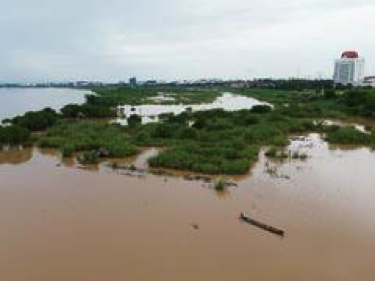 Aerial photo taken on Aug. 20, 2022 shows a villager fishing in Mekong River along submerged sandbanks, to the west of Lao capital Vientiane. (Photo by Kaikeo Saiyasane/Xinhua)
