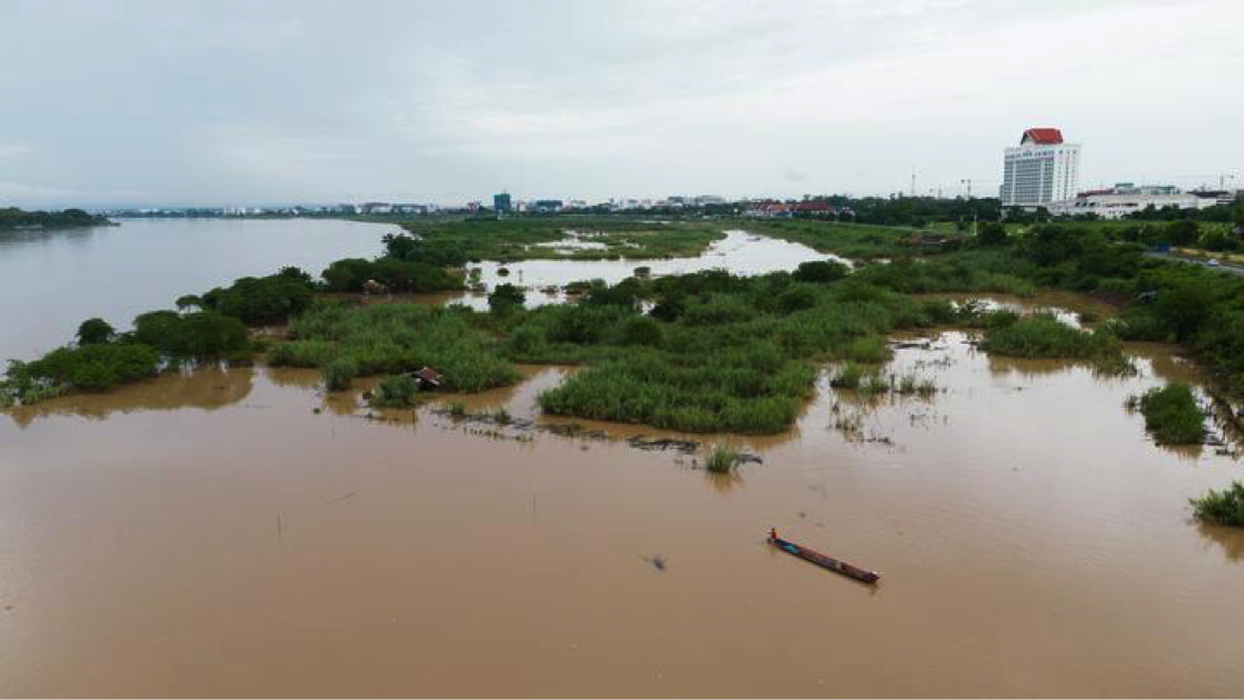 Aerial photo taken on August 20, 2022 shows villagers fish in Mekong River along their floating houses by the submerged sandbank, to the west of Lao capital Vientiane. (Photo by Kaikeo Saiyasane/Xinhua)